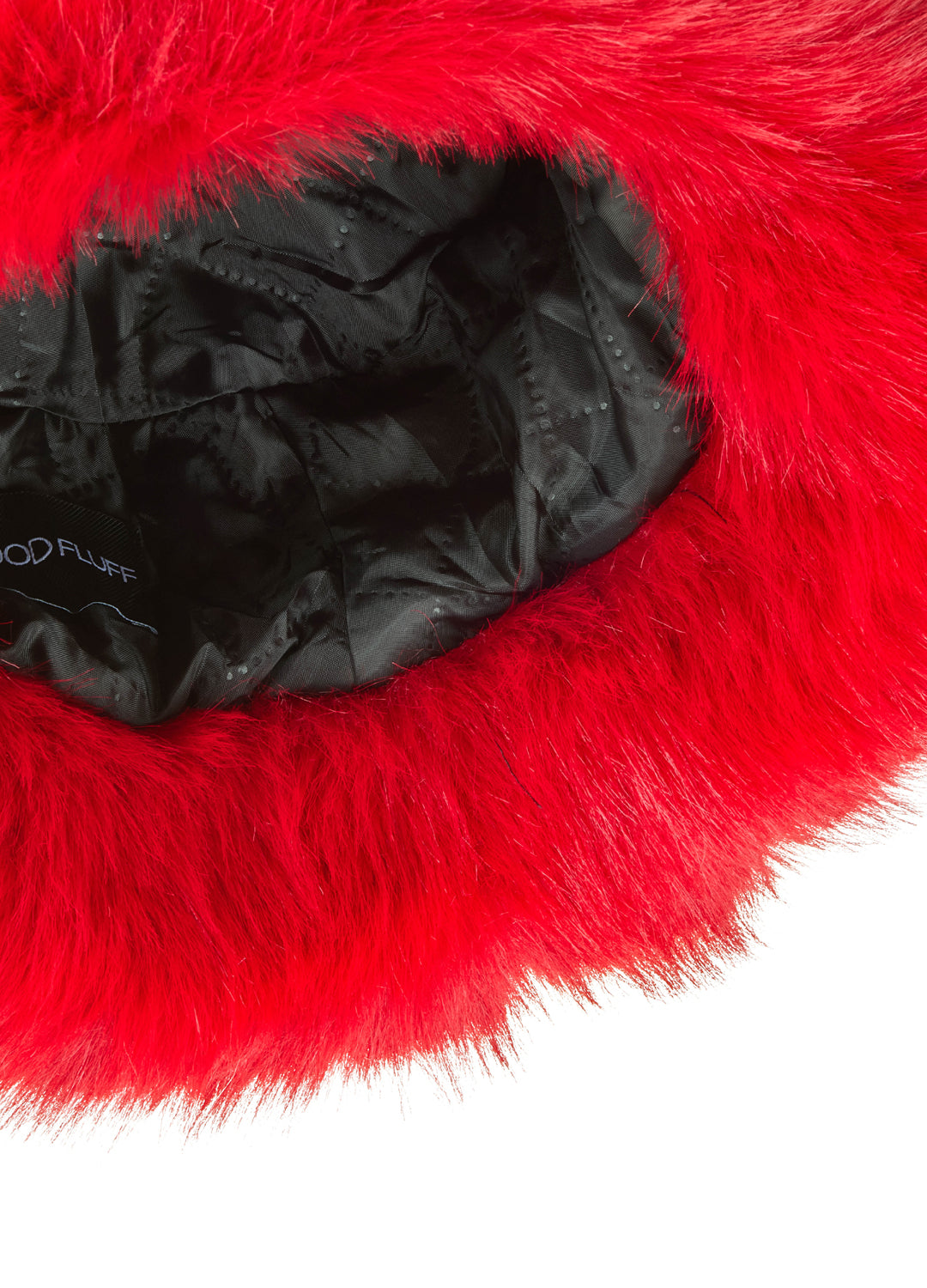 Close-up of a red fur product with a black interior on a white background