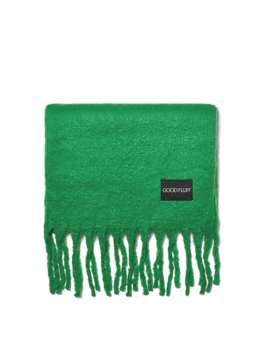 Green scarf with fringes and a black label on a white background