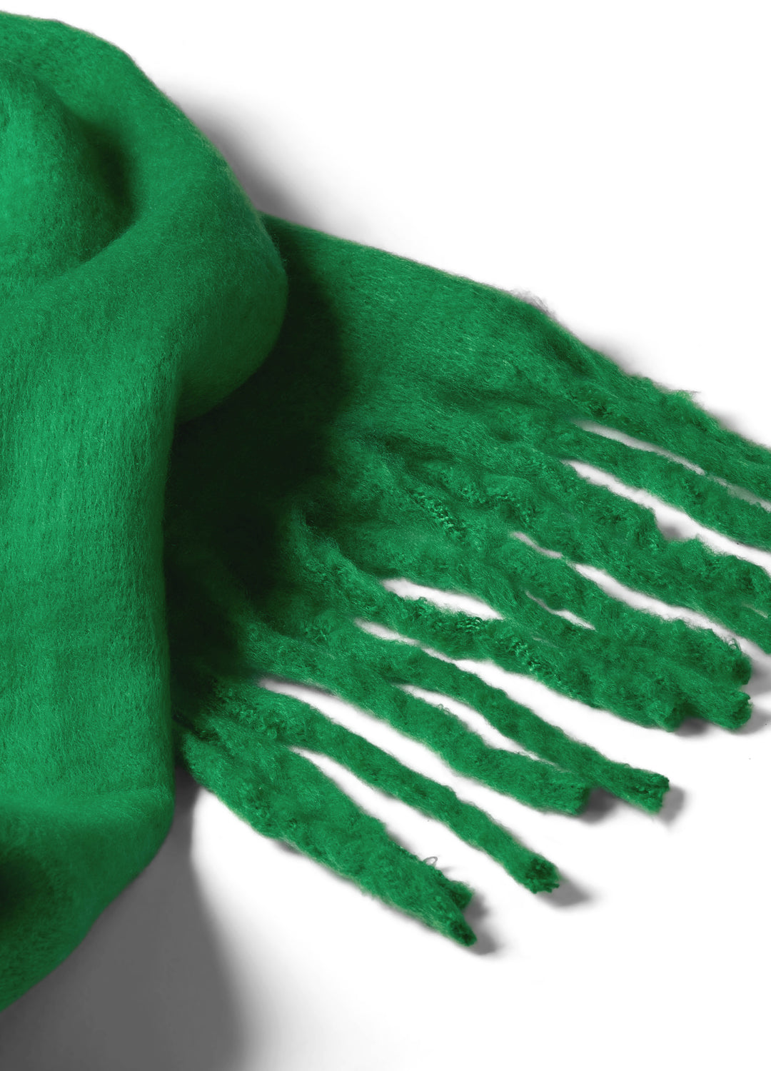 Green scarf with tassels on a white background