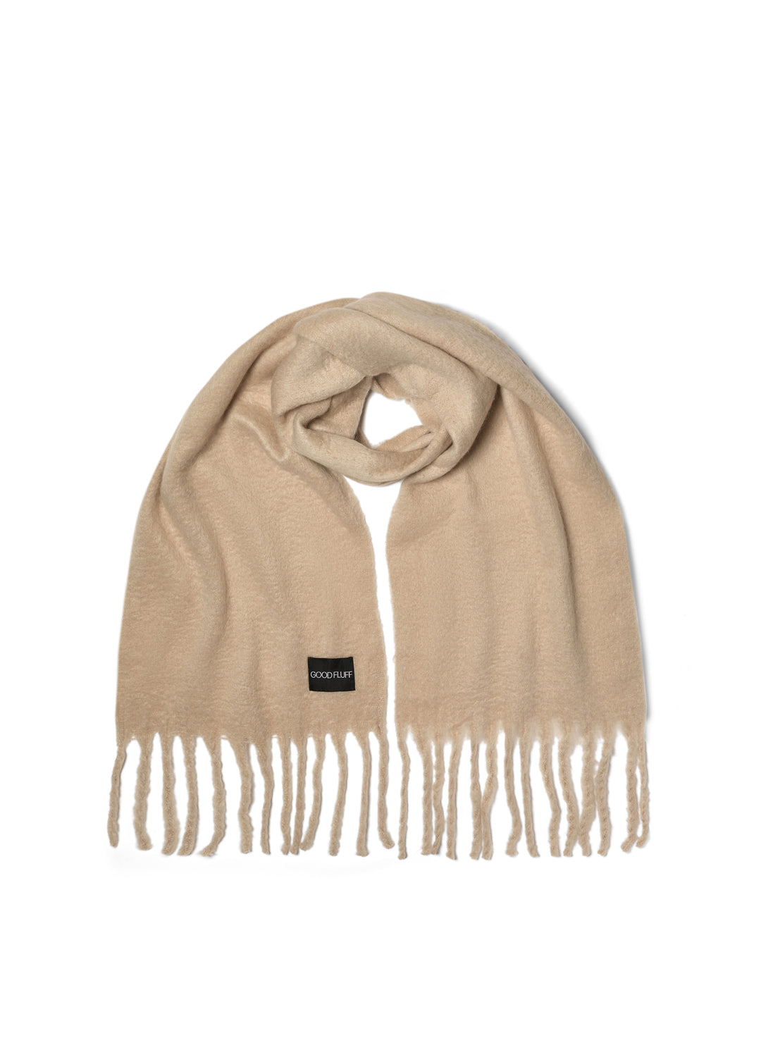 Beige creamy oat colour scarf with fringes on a white background