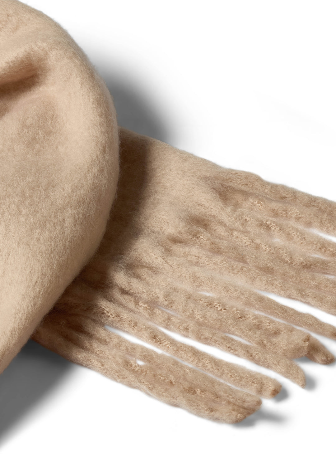 Creamy oaty beige scarf with fringe on a white background