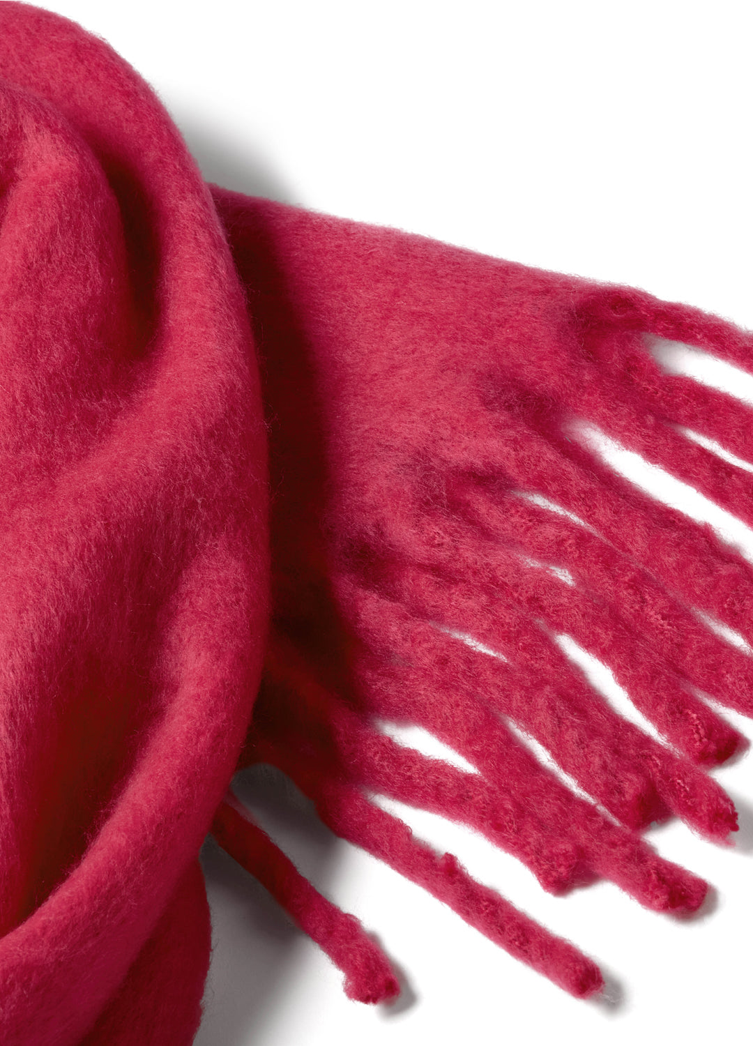 Close-up of a red/pink scarf with fringes on a white background