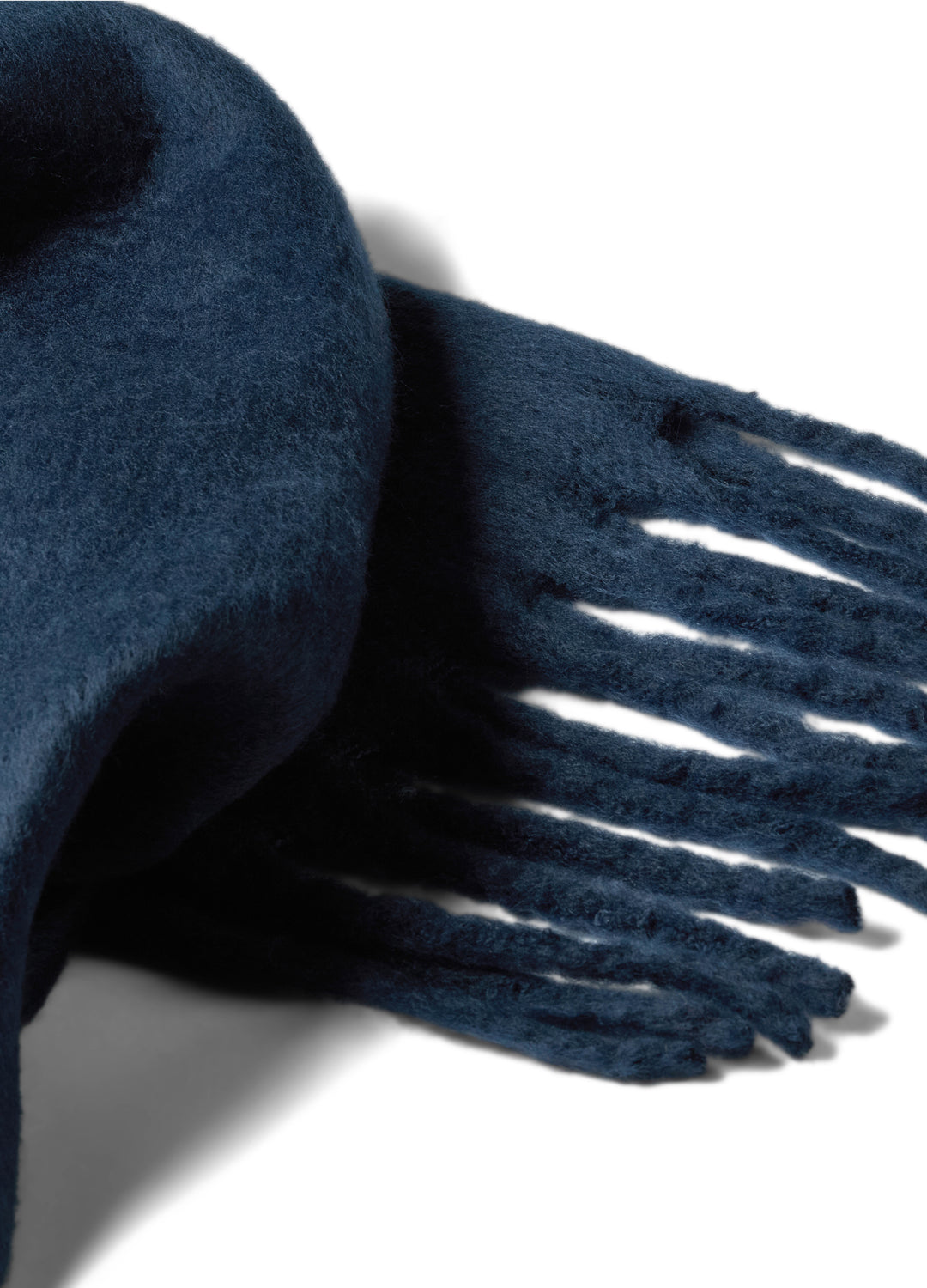 Navy inky blue scarf with tassels on a white background