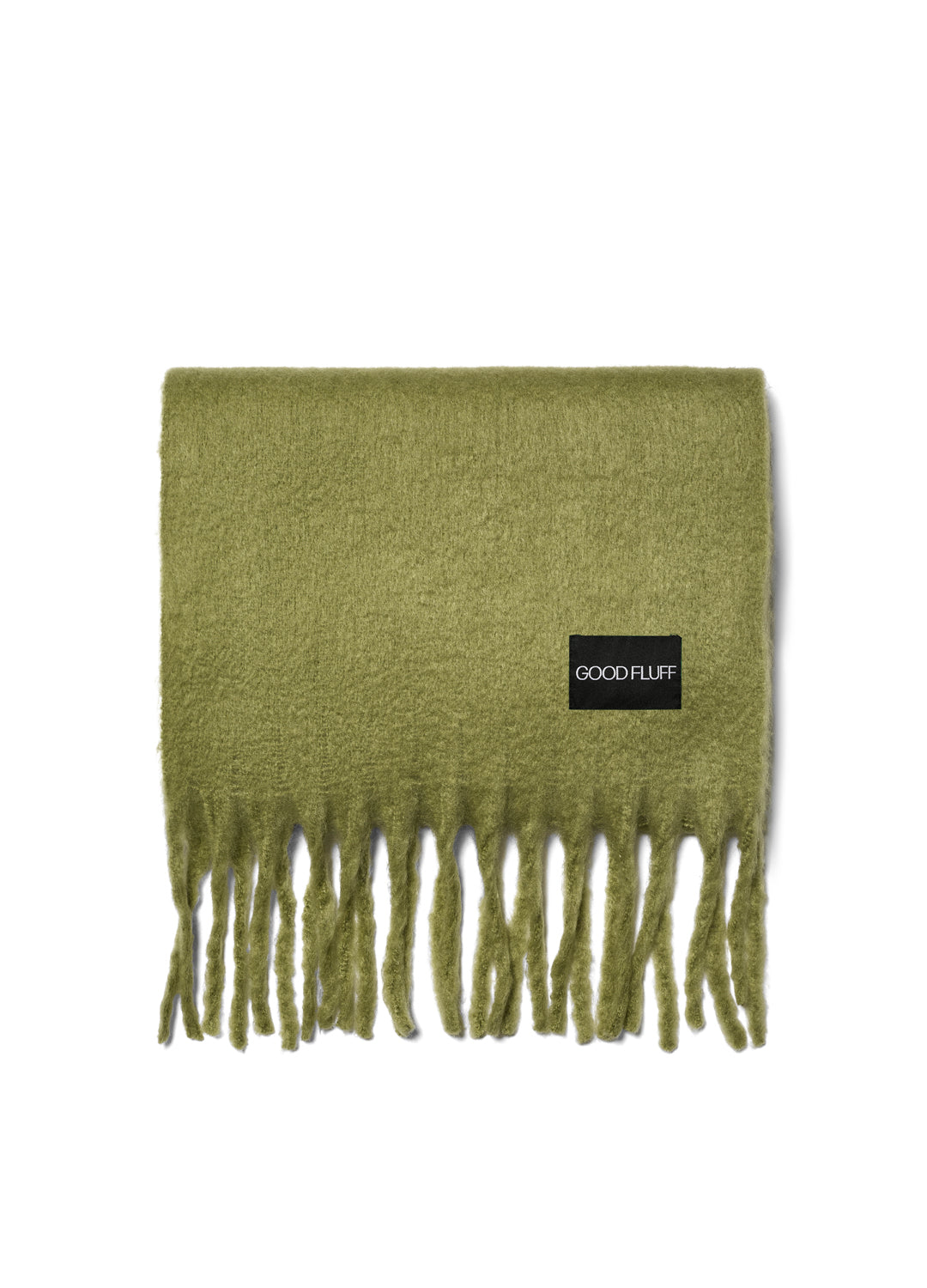 Green scarf with fringes and 'GOOD FLUFF' label on a white background