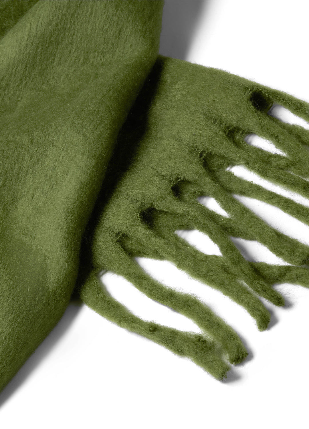 Green scarf with fringe detail on a white background