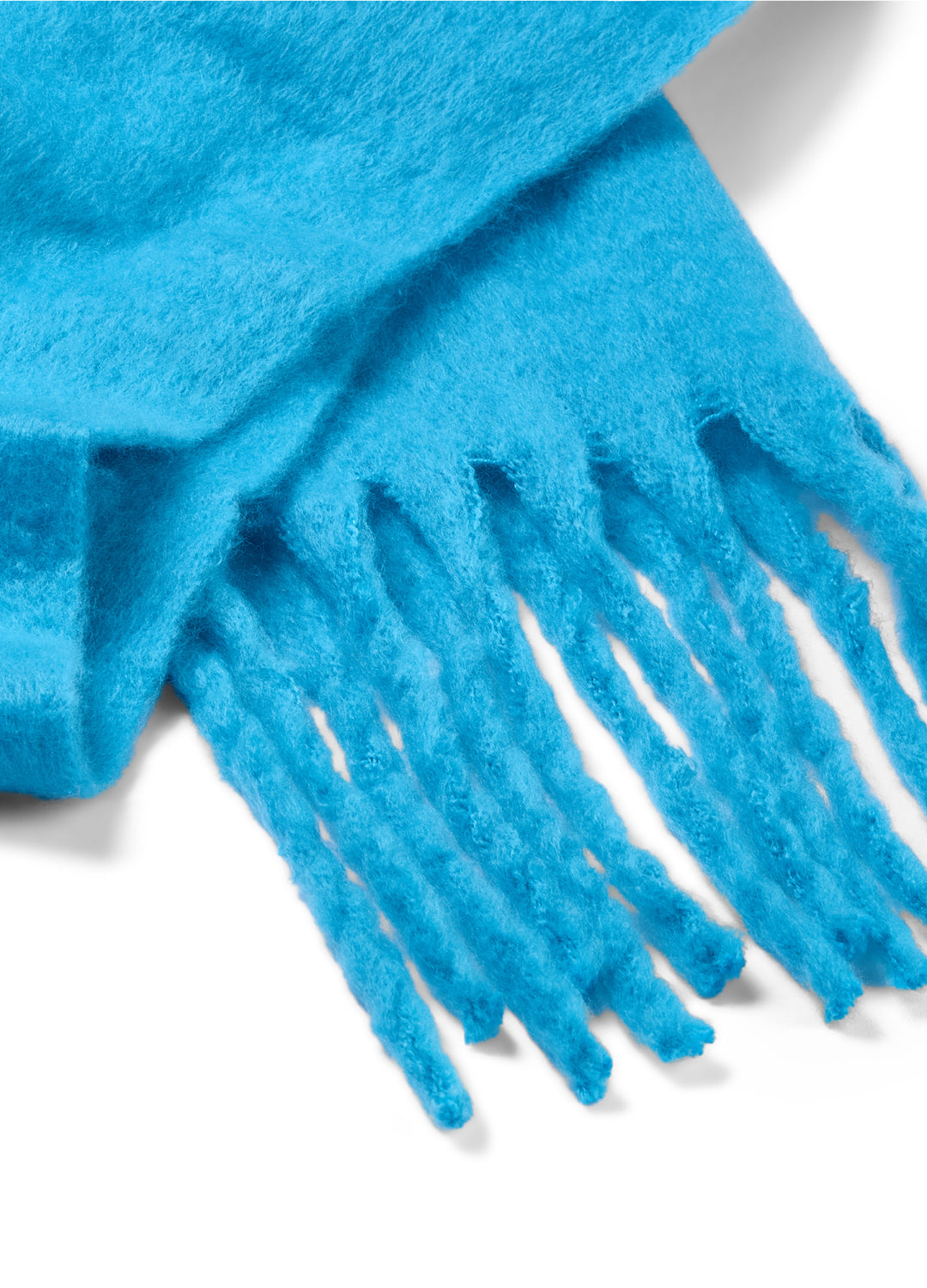 Close-up of a blue scarf with fringes on a white background