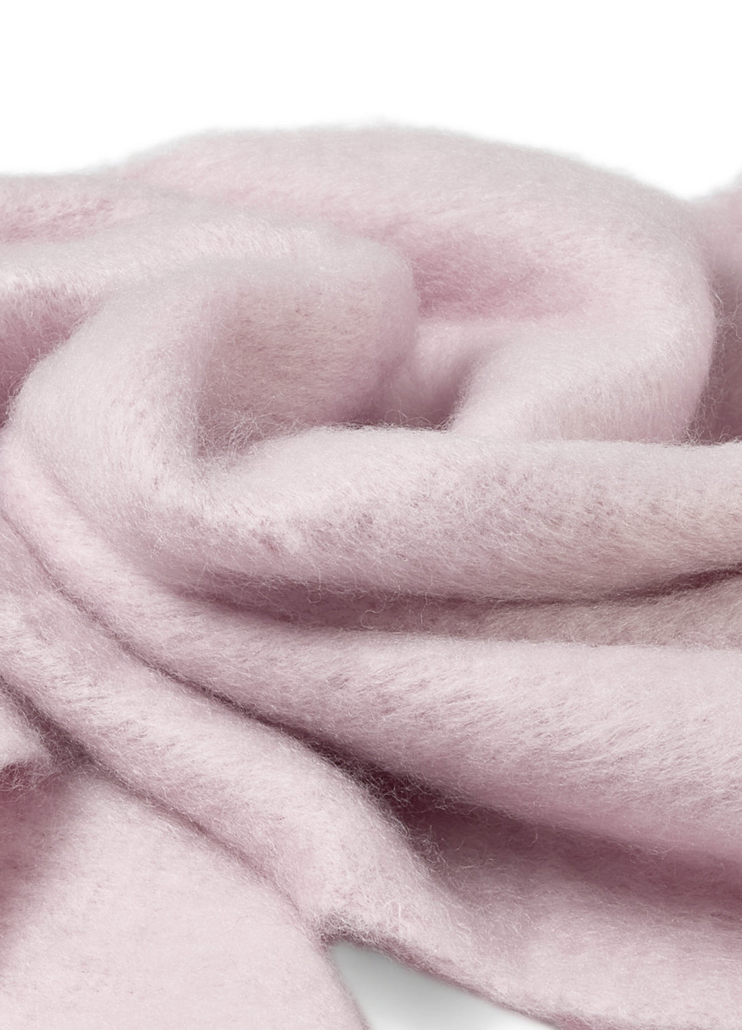 Close-up of pink fabric with a soft texture on a white background