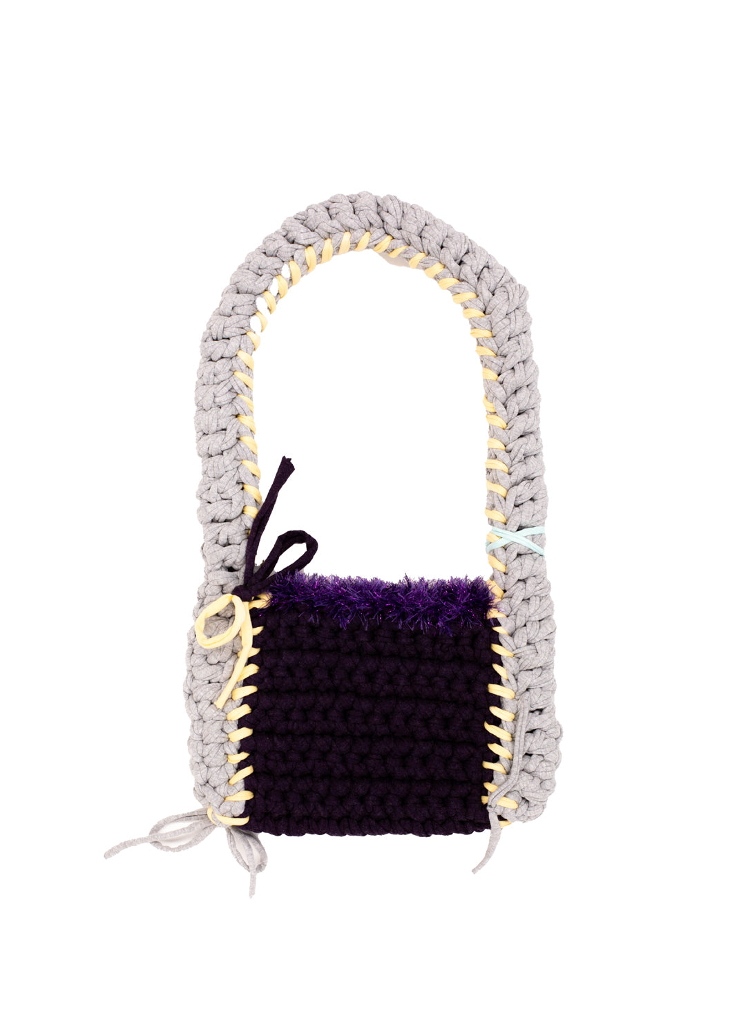 Crocheted bag with a purple base and gray handle on a white background