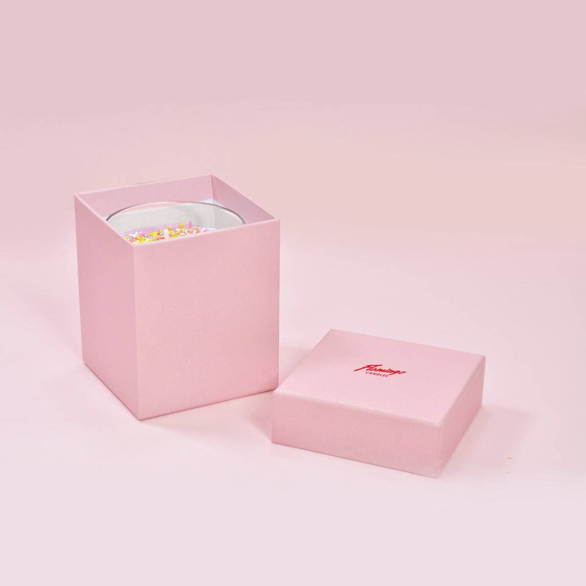 pink packaging box of the scented sweet candle by Flamingo