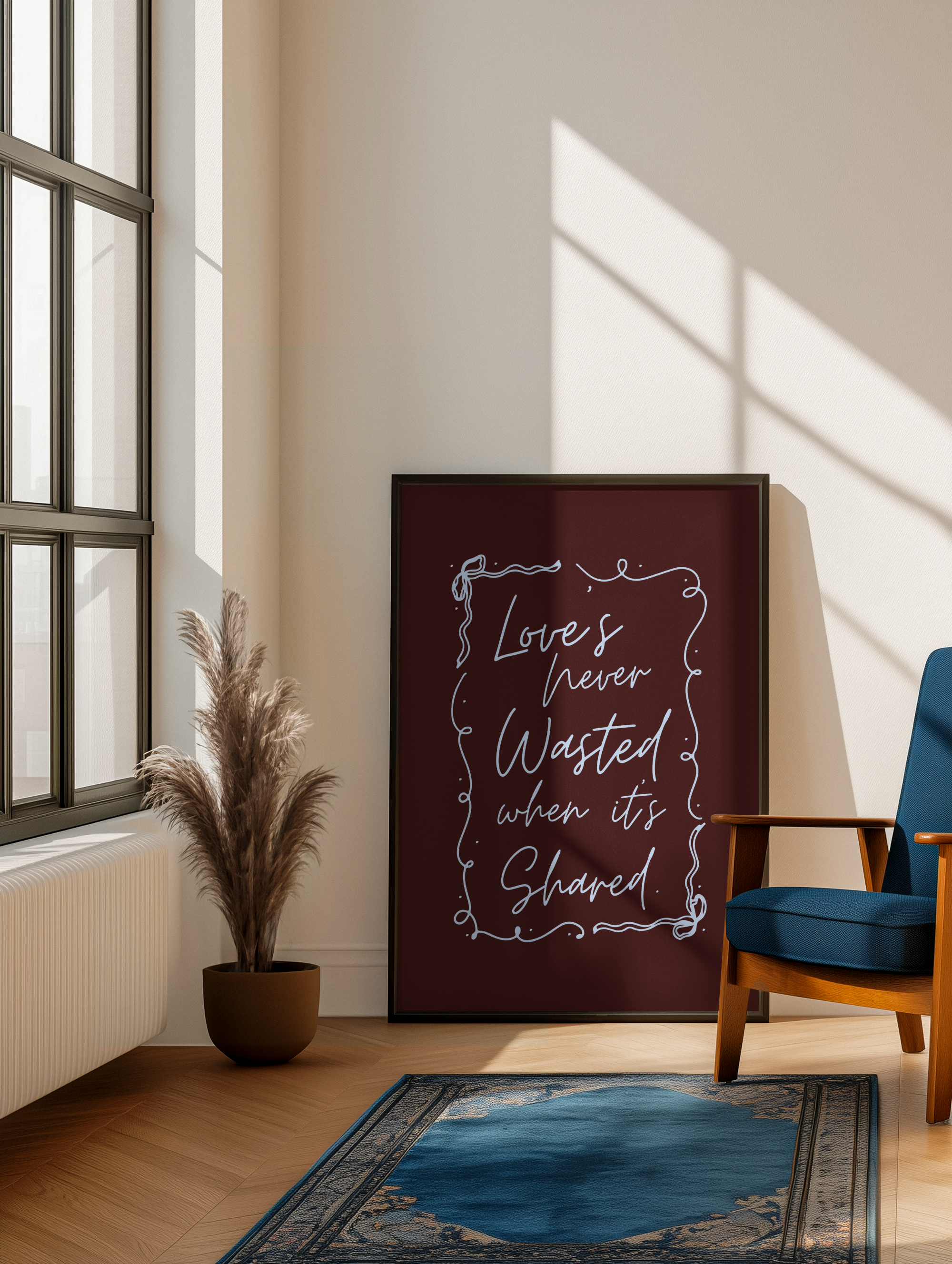 Room interior with a framed print quote on the wall, a plant, and a chair.