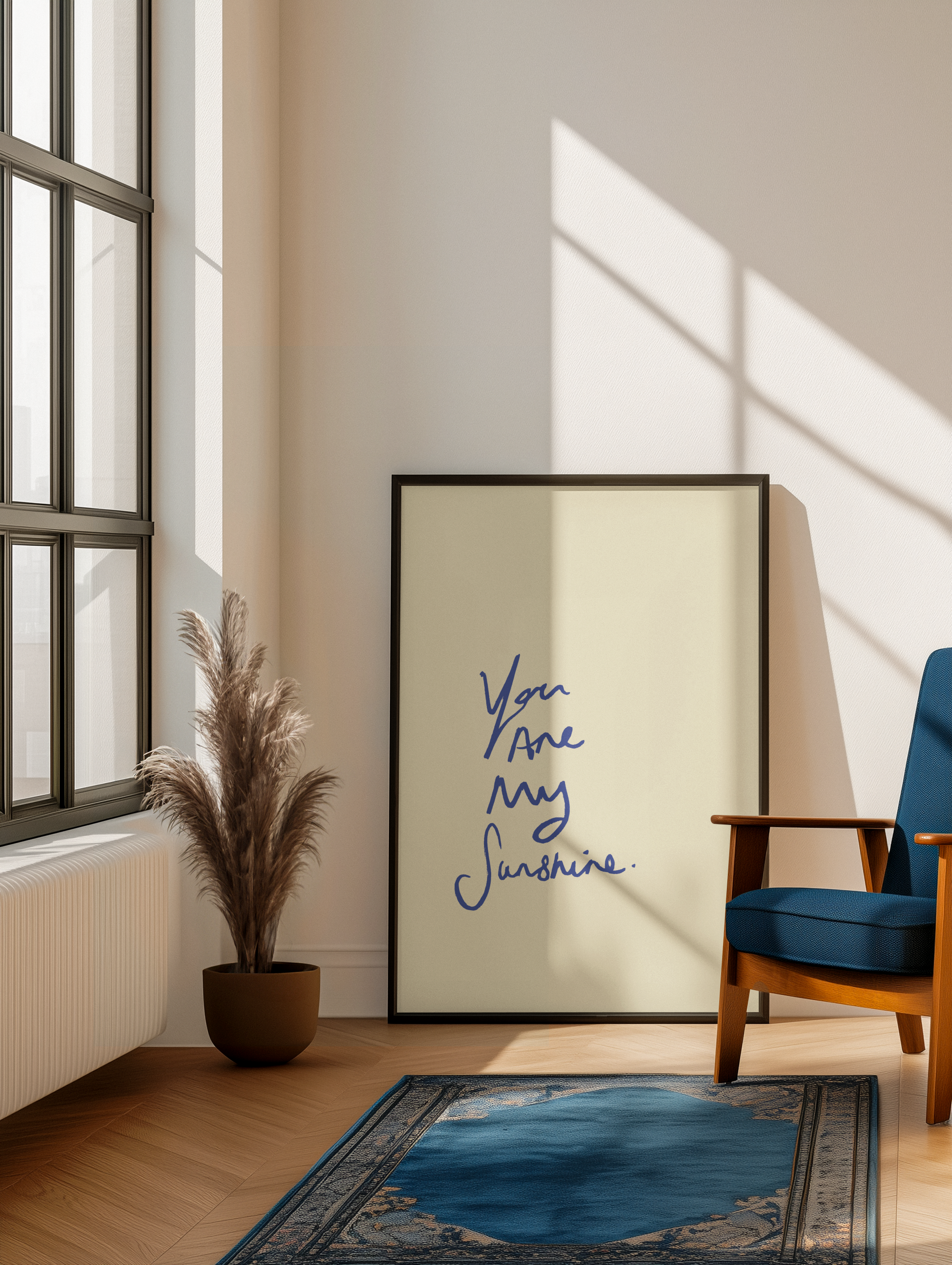 Framed artwork with 'You are my sunshine' quote in a modern living room.