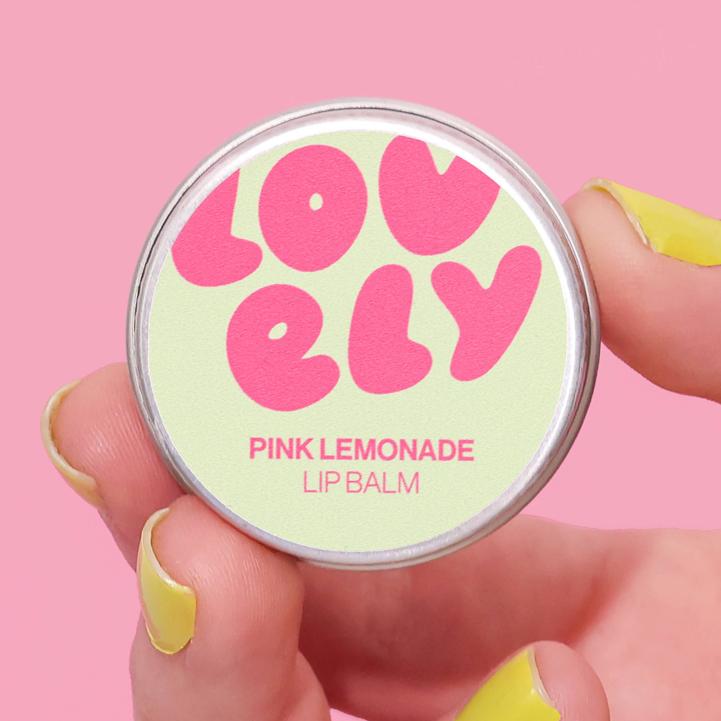 Lip balm container with 'Lovely' and 'Pink Lemonade' text on a pink background