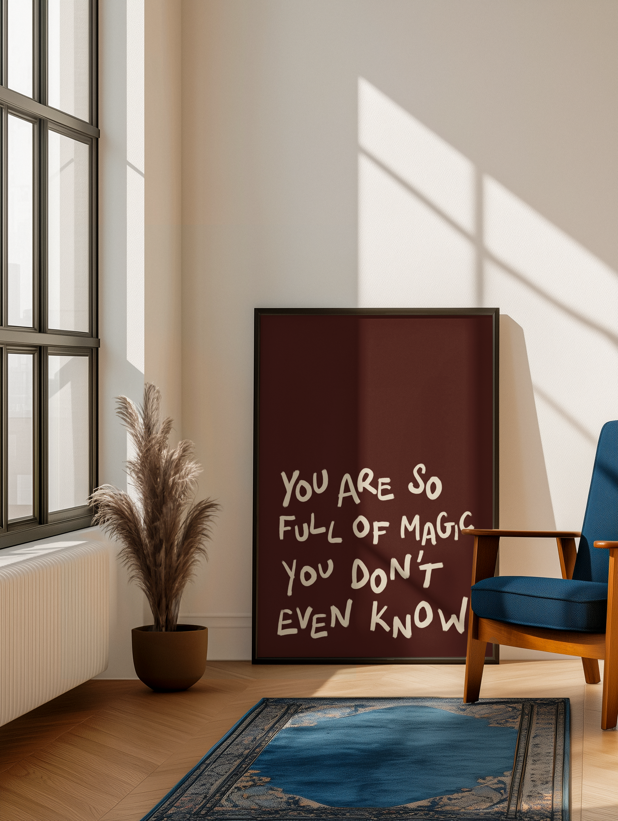 Room interior with a motivational quote on a wall, a plant, and a chair.