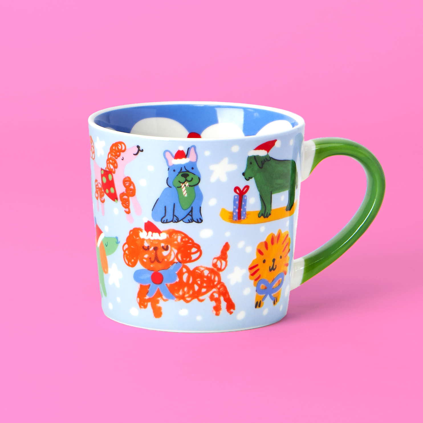 Colorful mug with animal illustrations on a pink background