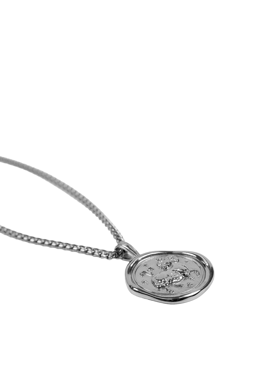 A gold chain necklace featuring an oval wax seal pendant with a raised, textured animal design, shown against a plain white background.