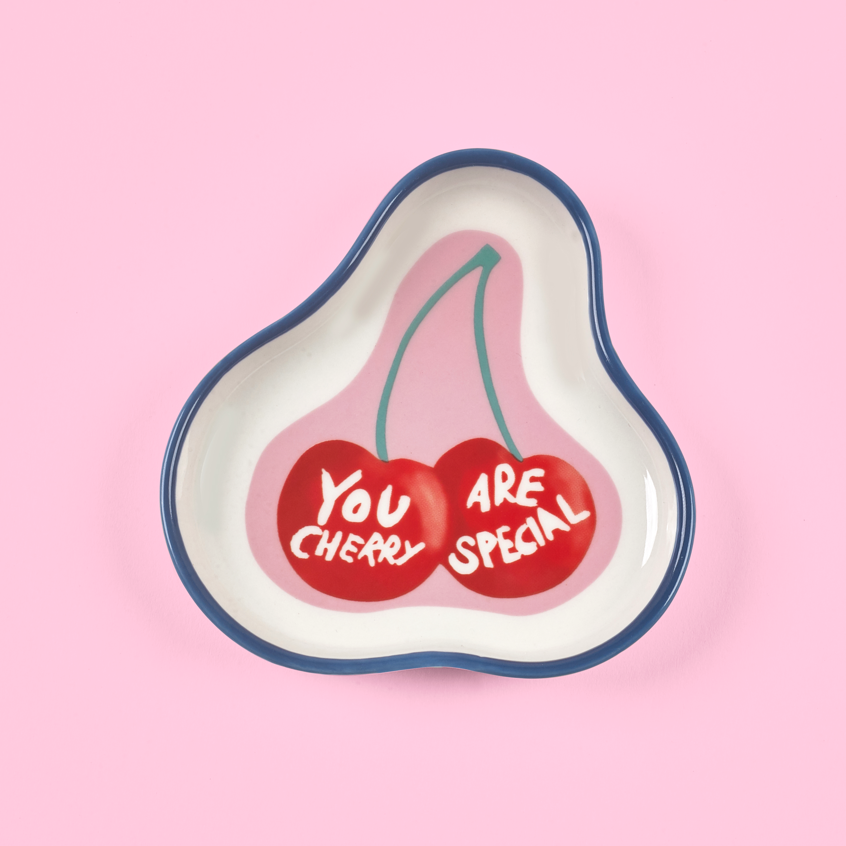 Heart-shaped dish with cherry design and 'You Are Cherry Special' text on a pink background