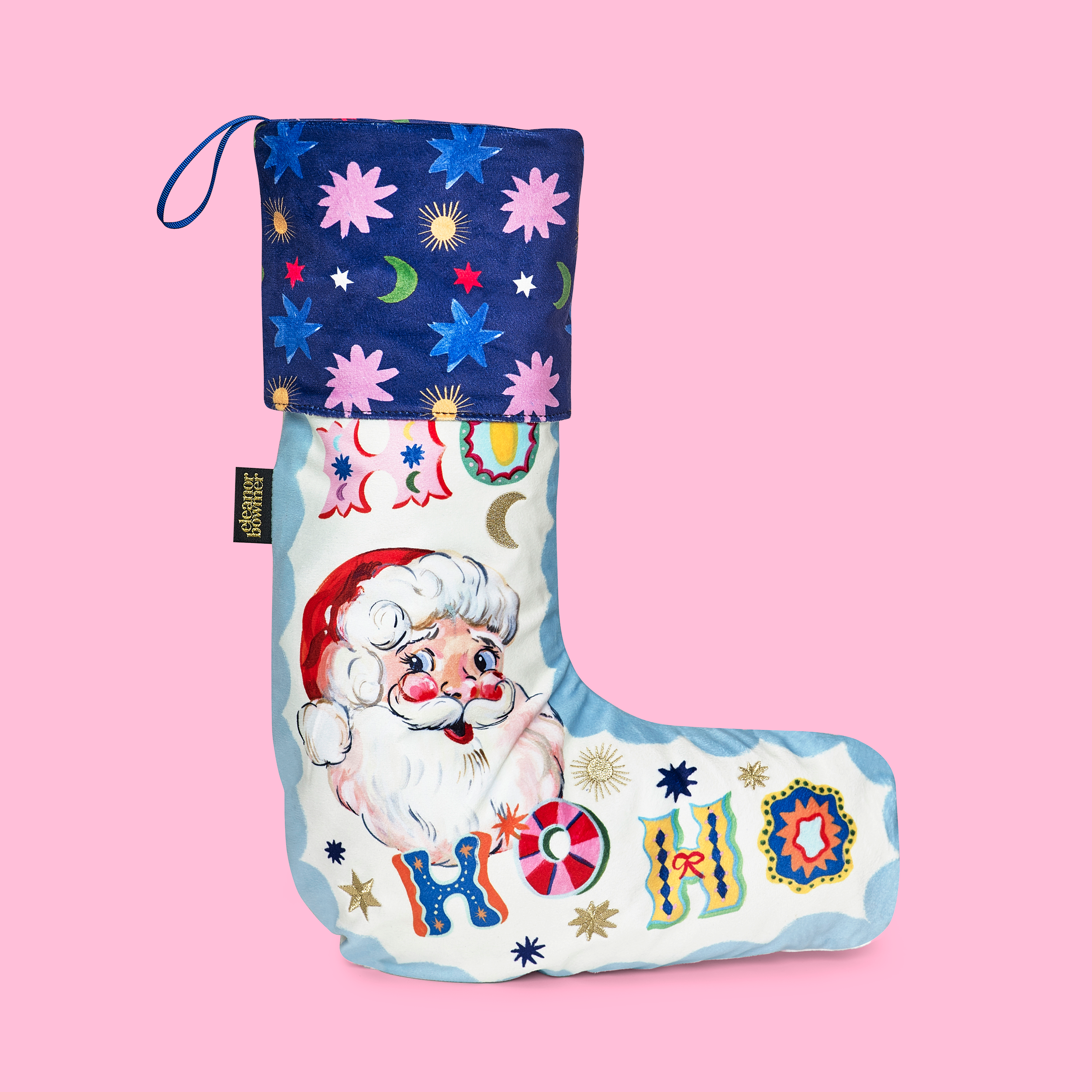 Decorative Christmas stocking with Santa Claus design on a pink background