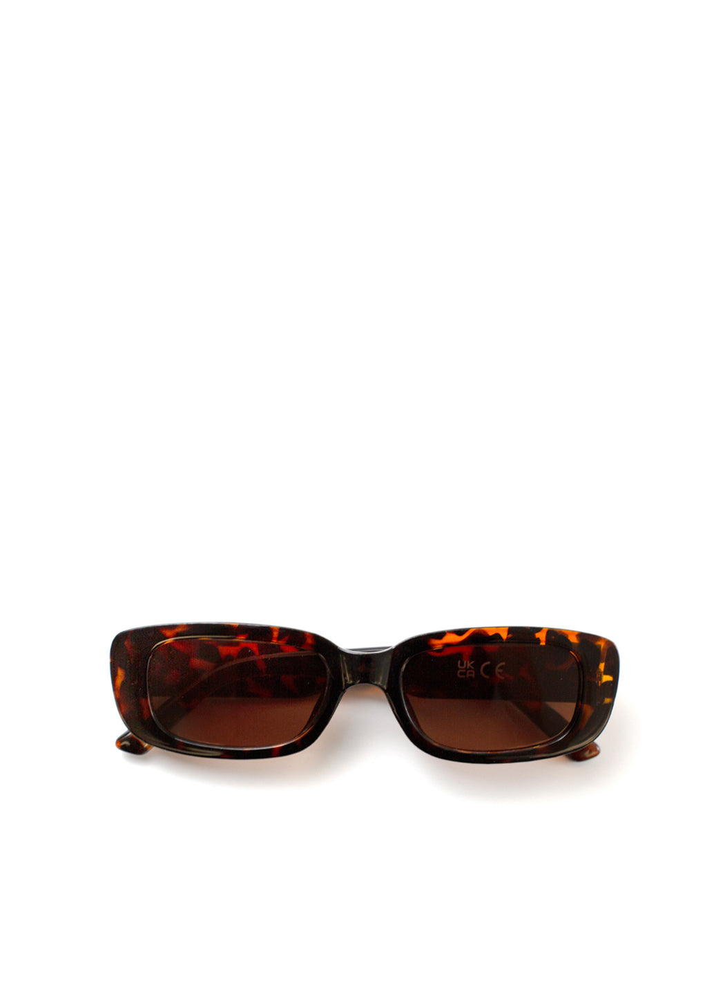 Sunglasses with tortoiseshell frame and brown lenses on a white background