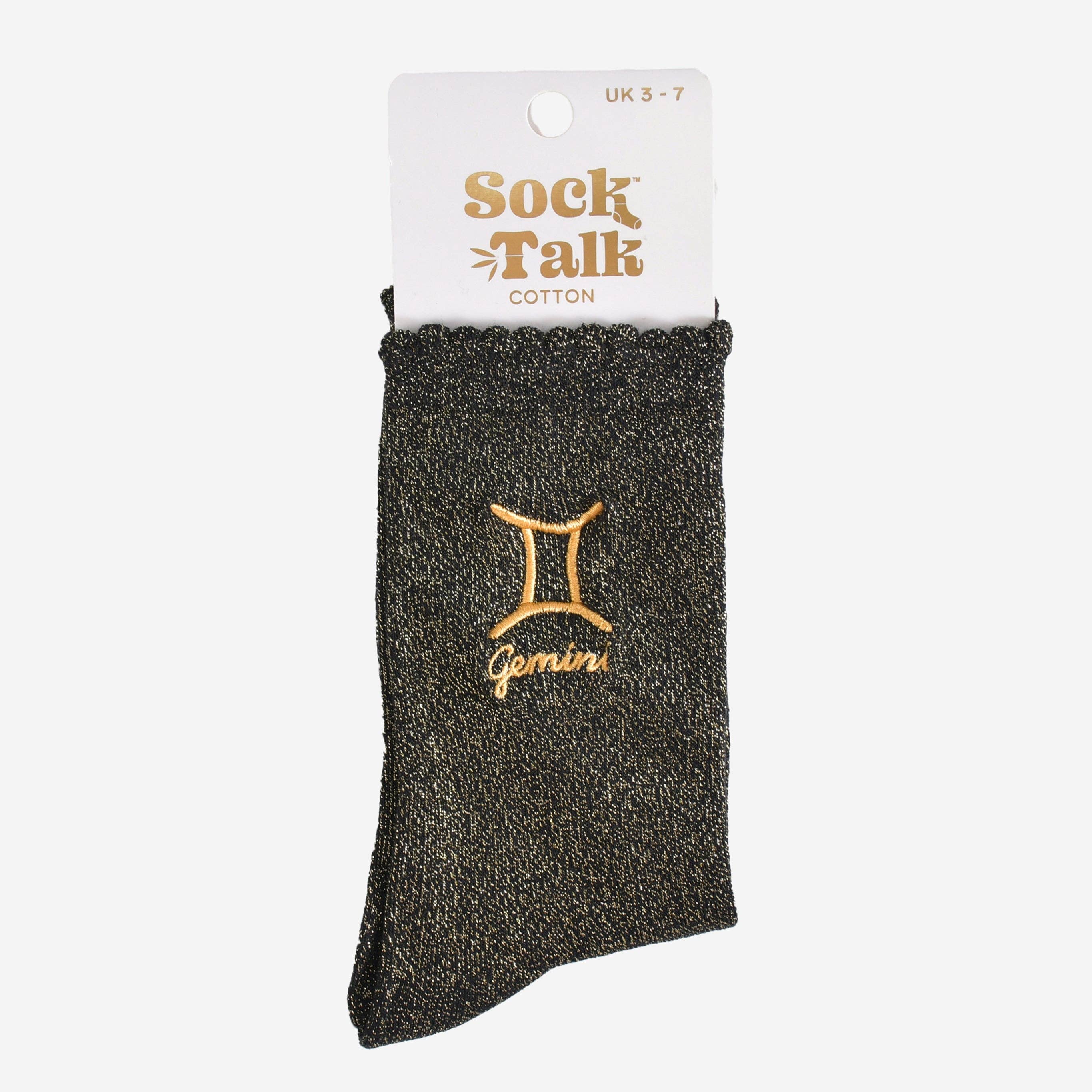 Black sock with gold Gemini symbol on a white background