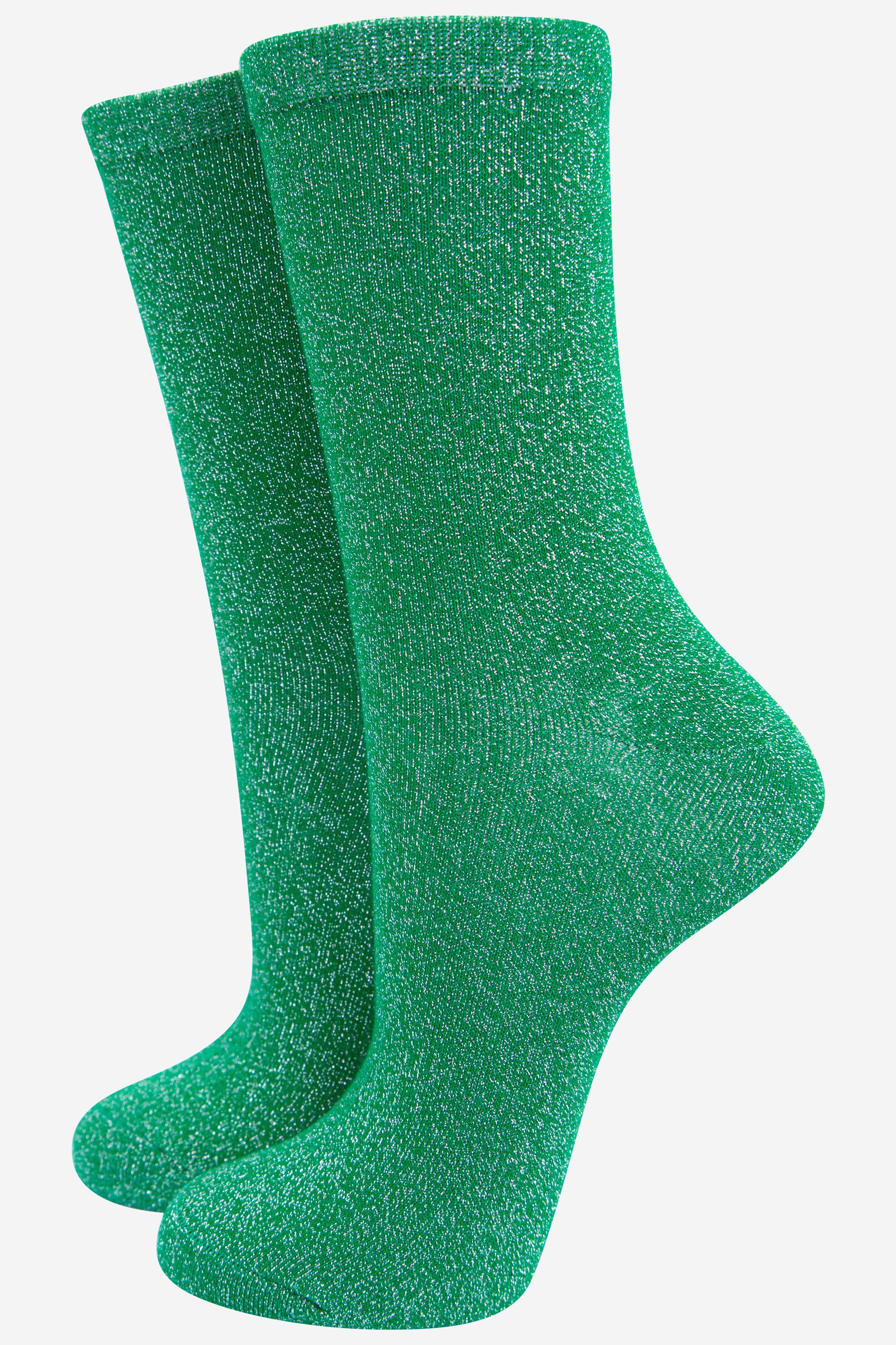 Pair of green socks on a white background