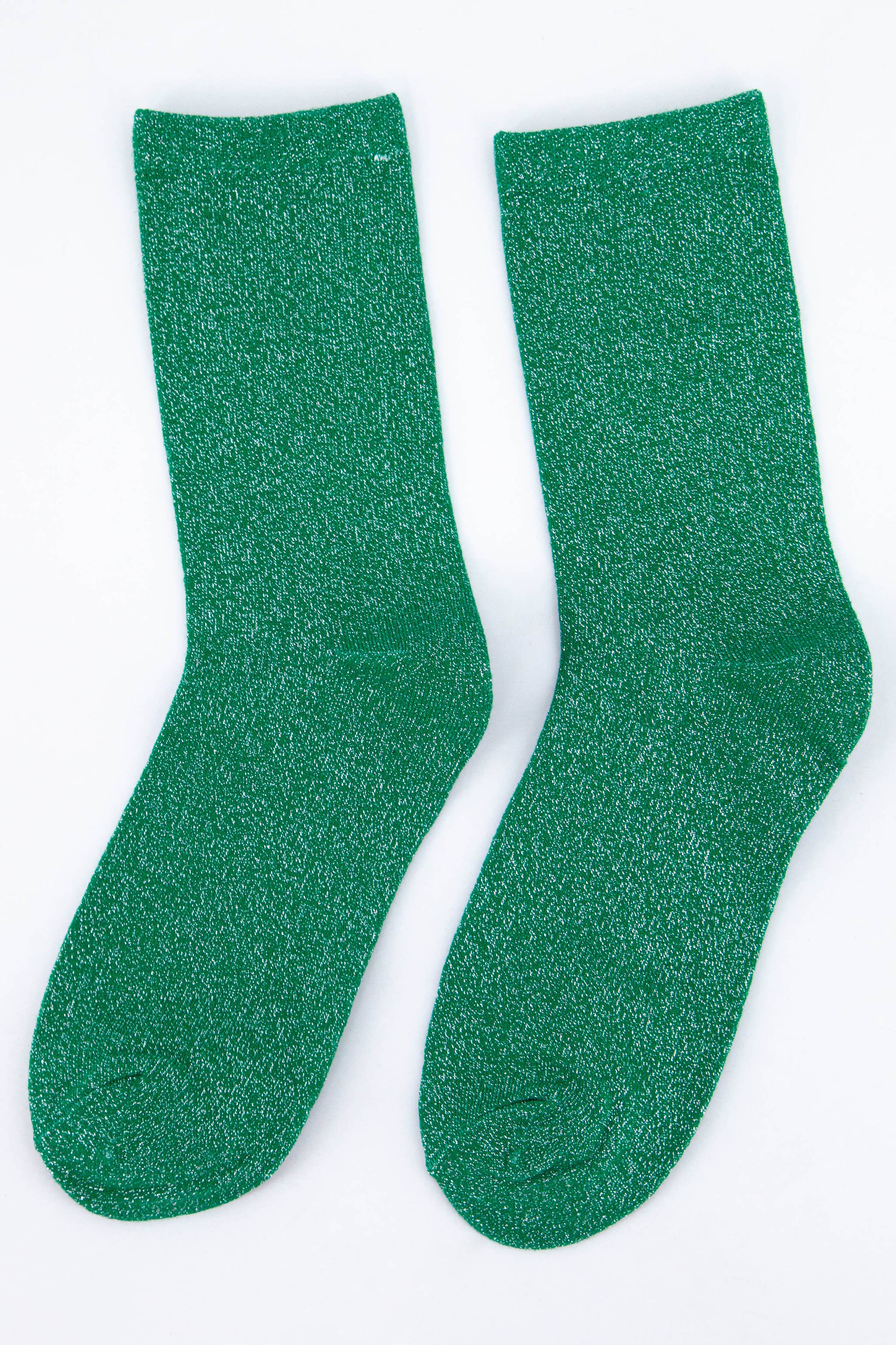 Pair of green glitter socks on a white background
