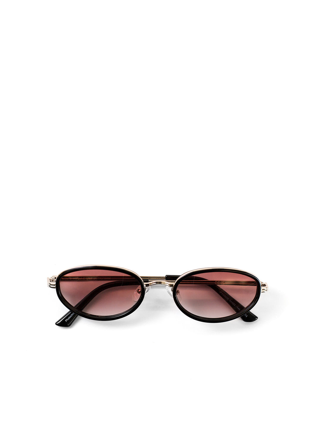 Sunglasses with gold frame and pink gradient lenses on a white background