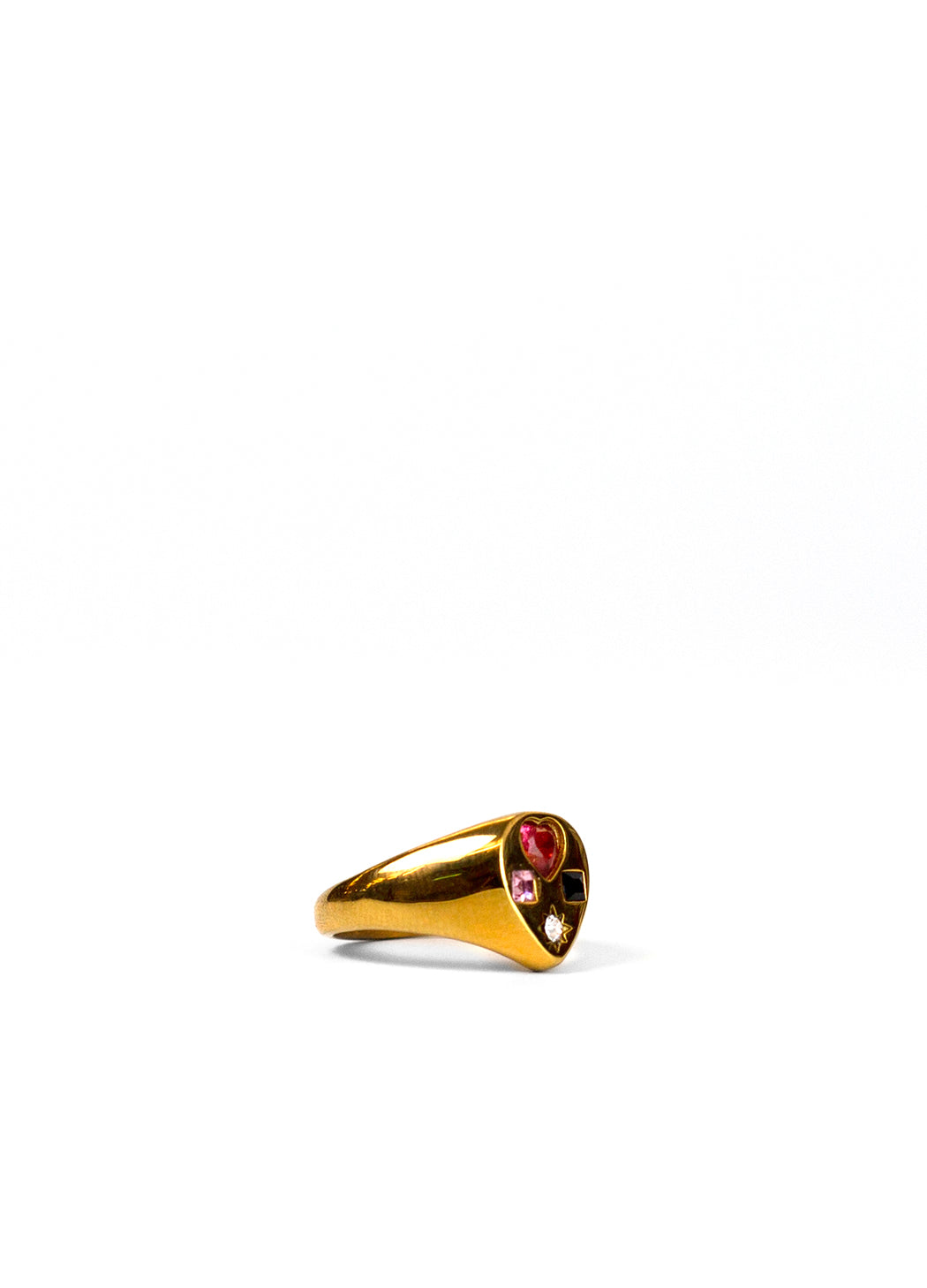 gold teardrop signet ring from the side showing the thick band against a white backdrop