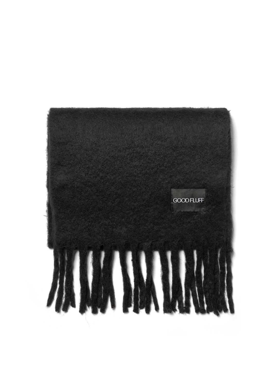 Black scarf with fringes and a brand label on a white background
