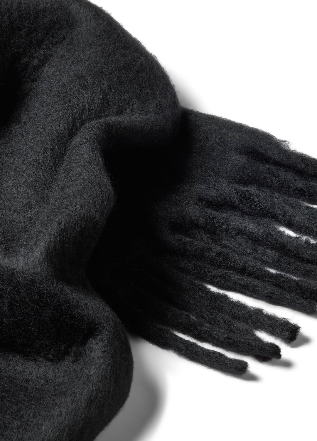 Black scarf with tassels on a white background