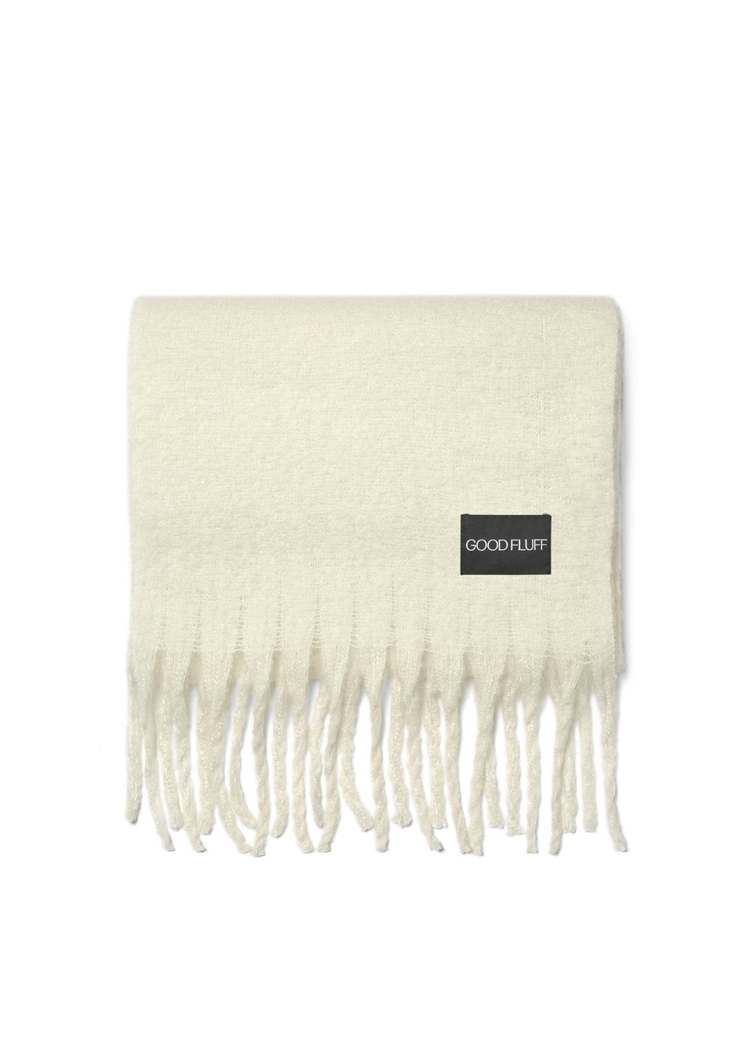 Lunar white blanket scarf with fringe and 'Good Fluff' label on a white background
