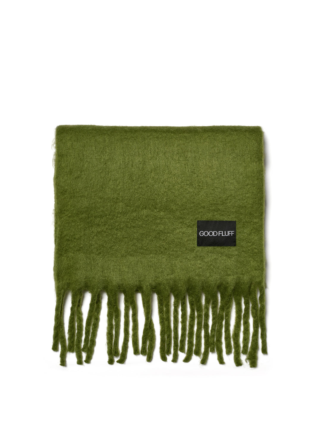 Green scarf with fringes and 'GOOD FLUFF' label on a white background
