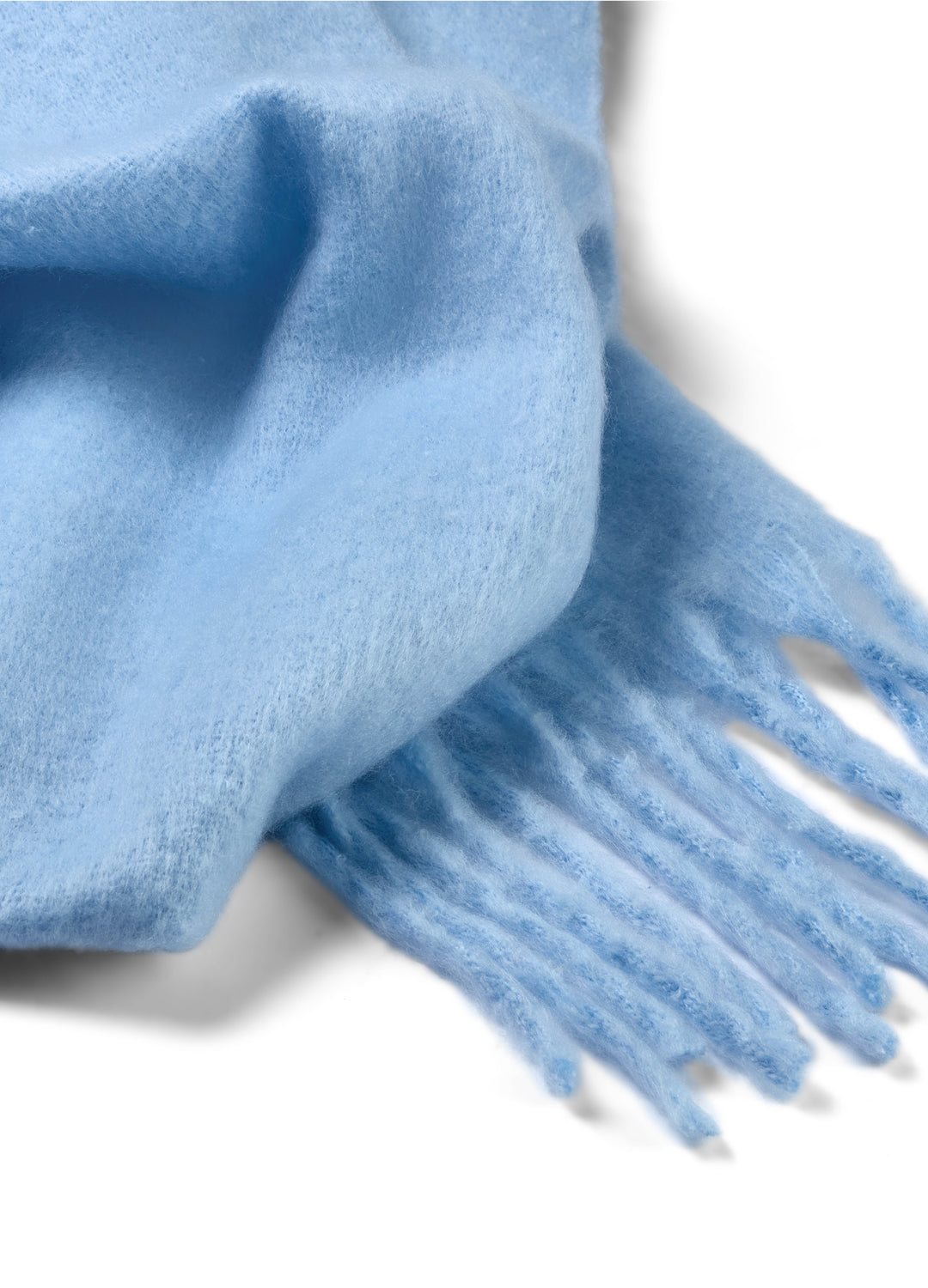 Close-up of a blue scarf with fringes on a white background
