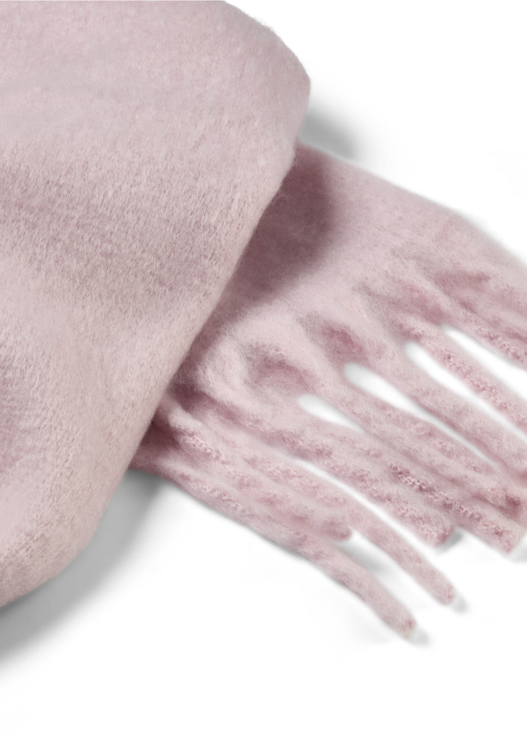 Light pink scarf with fringe on a white background