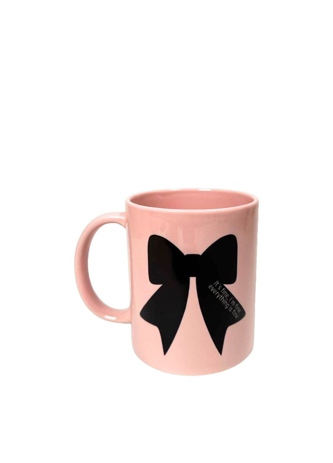 Pink mug with a black bow design on a white background