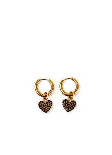 A pair of gold hoop earrings with dangling heart charms covered in small black rhinestones, set against a plain white background.