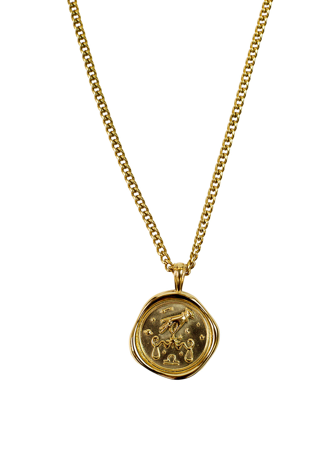 A gold chain necklace with a round, textured wax-seal style pendant featuring a a Libra zodiac symbolism design shown against a plain white background.