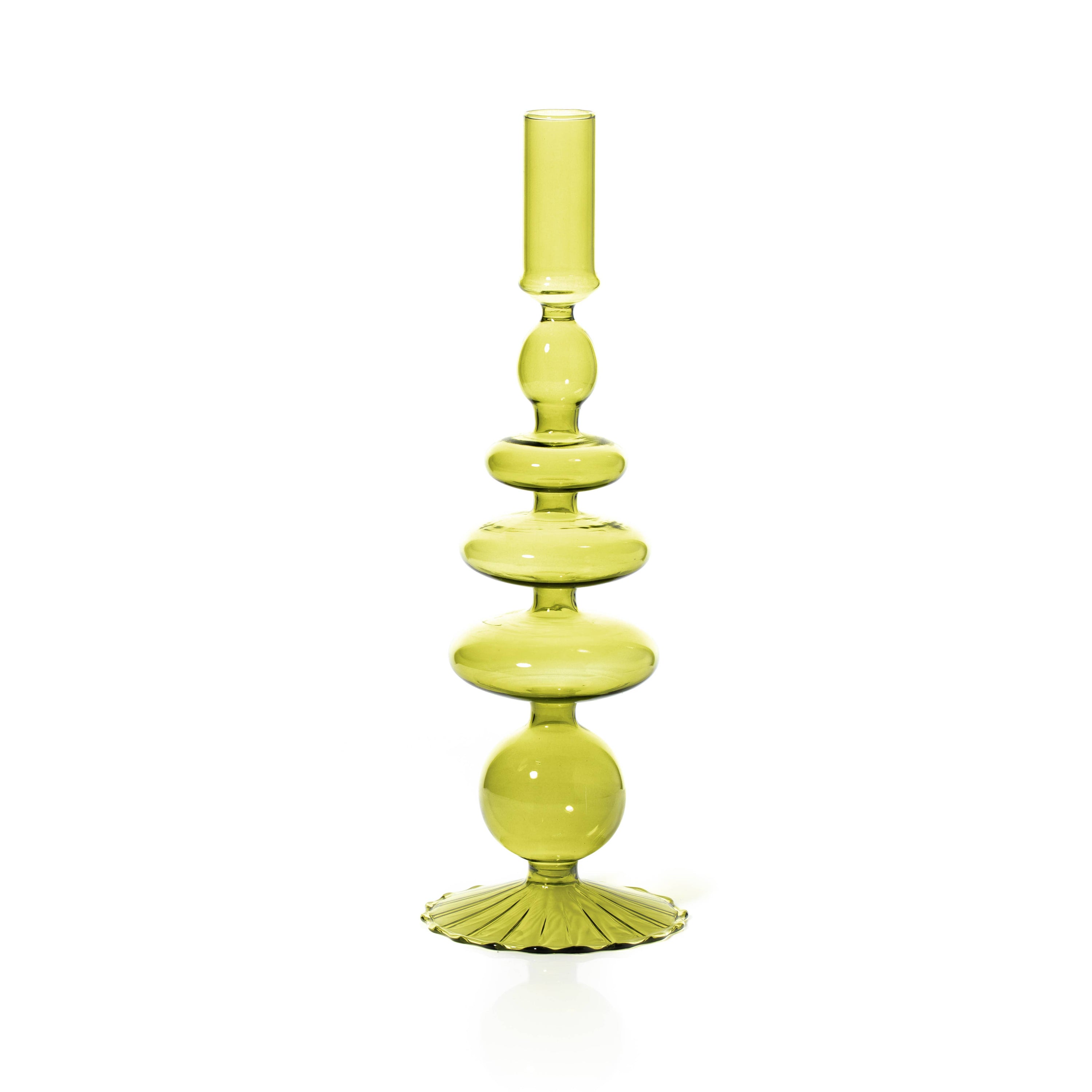 Green glass candle holder on a white background