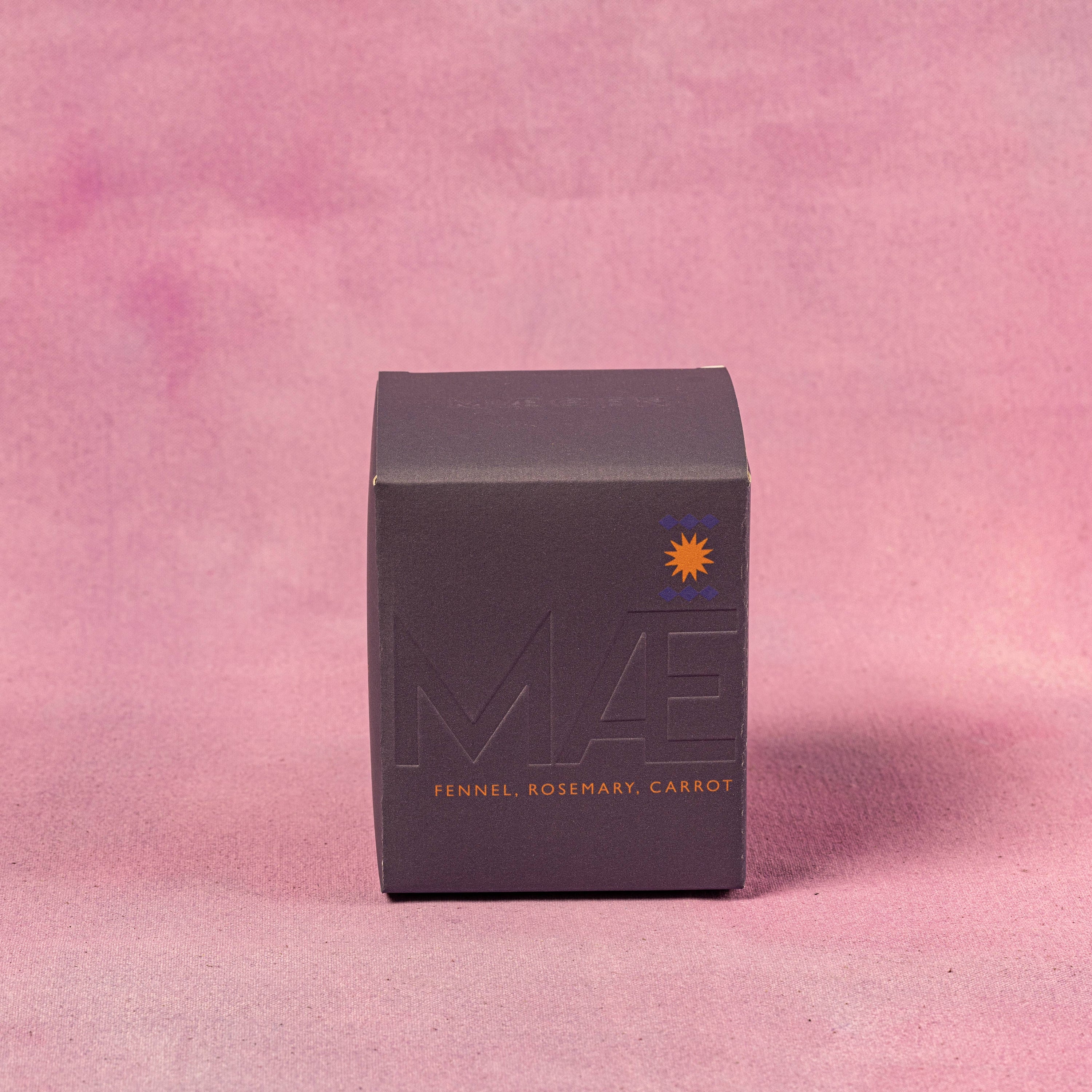Black GIFT BOX OF CANDLE with 'MAEGEN' branding on a pink background