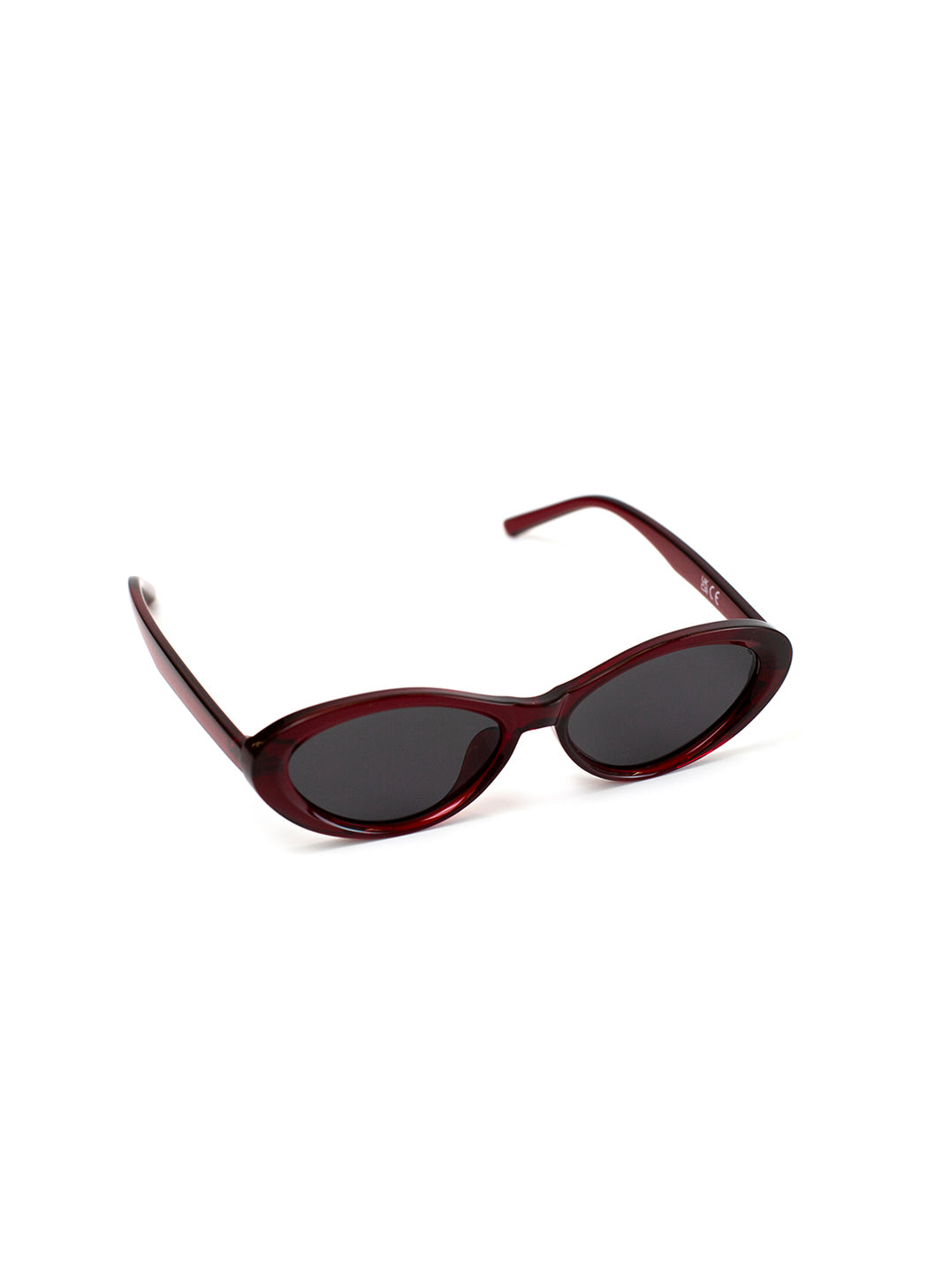 Red sunglasses with dark lenses on a white background