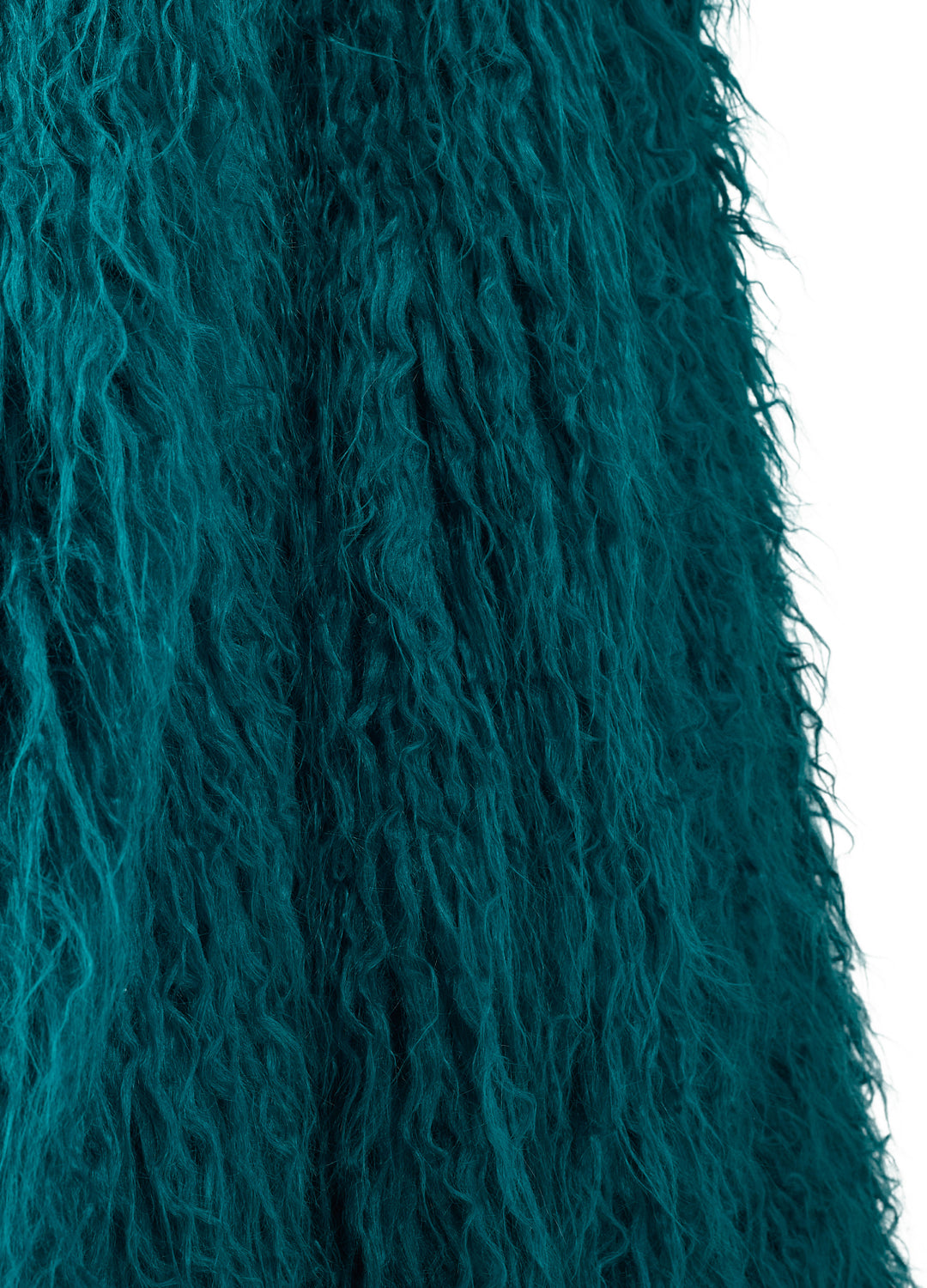 Close-up of teal fur texture on a white background