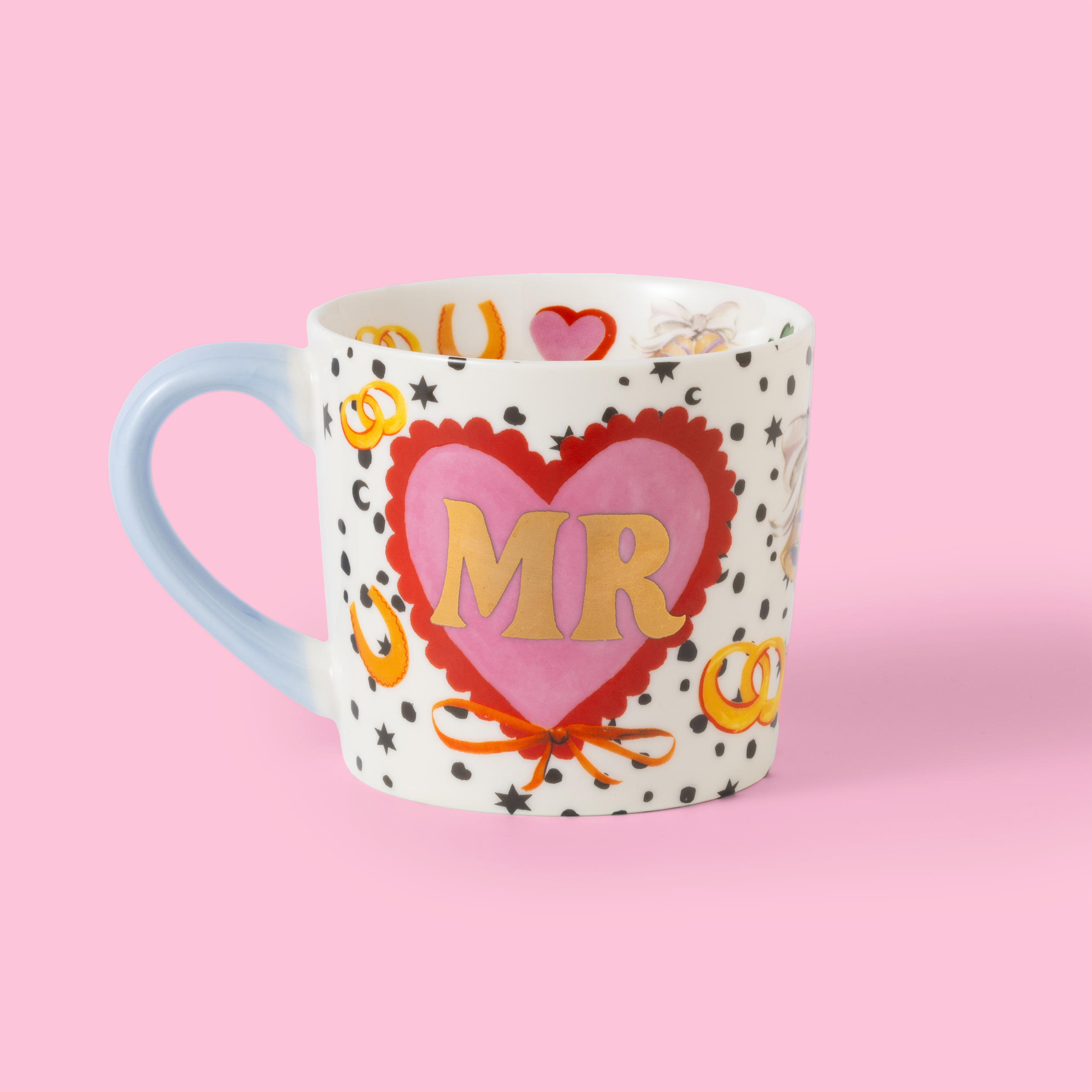 Mug with 'MR' on a heart design against a pink background