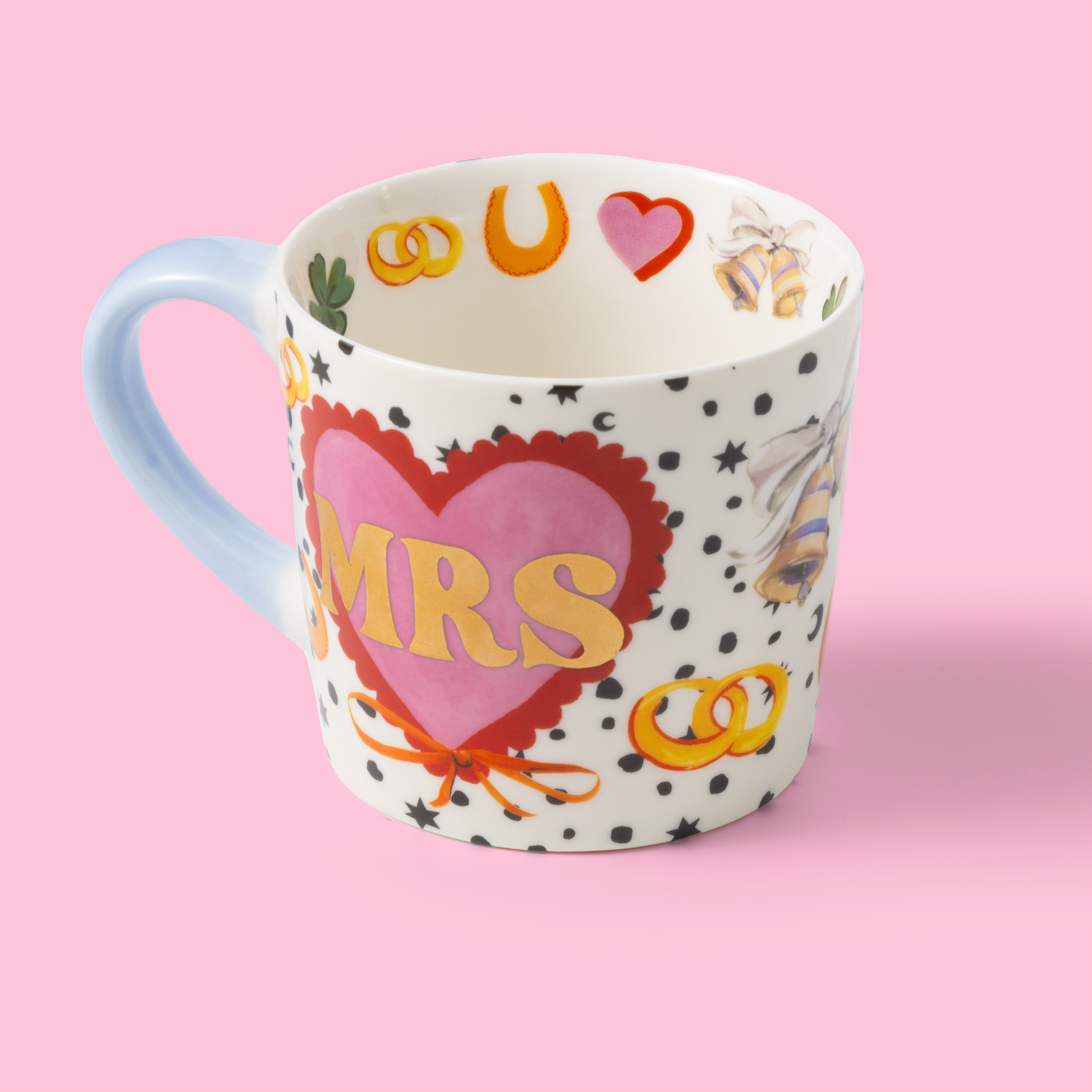 Decorative mug with 'MRS' on a pink background