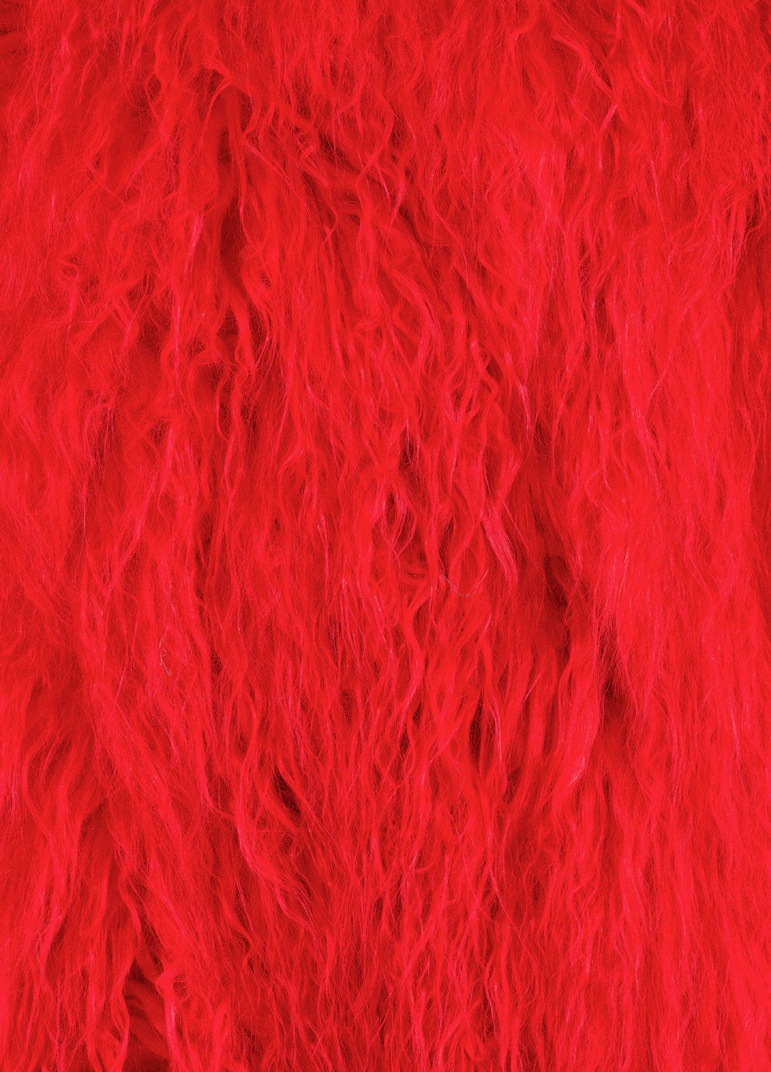 Close-up of bright red textured faux fur fluffy fabric