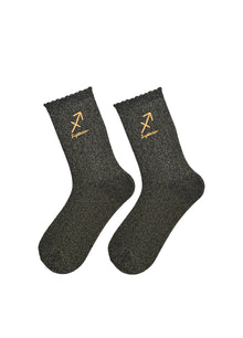 Pair of dark grey socks with gold 'Sagittarius' symbol on a white background