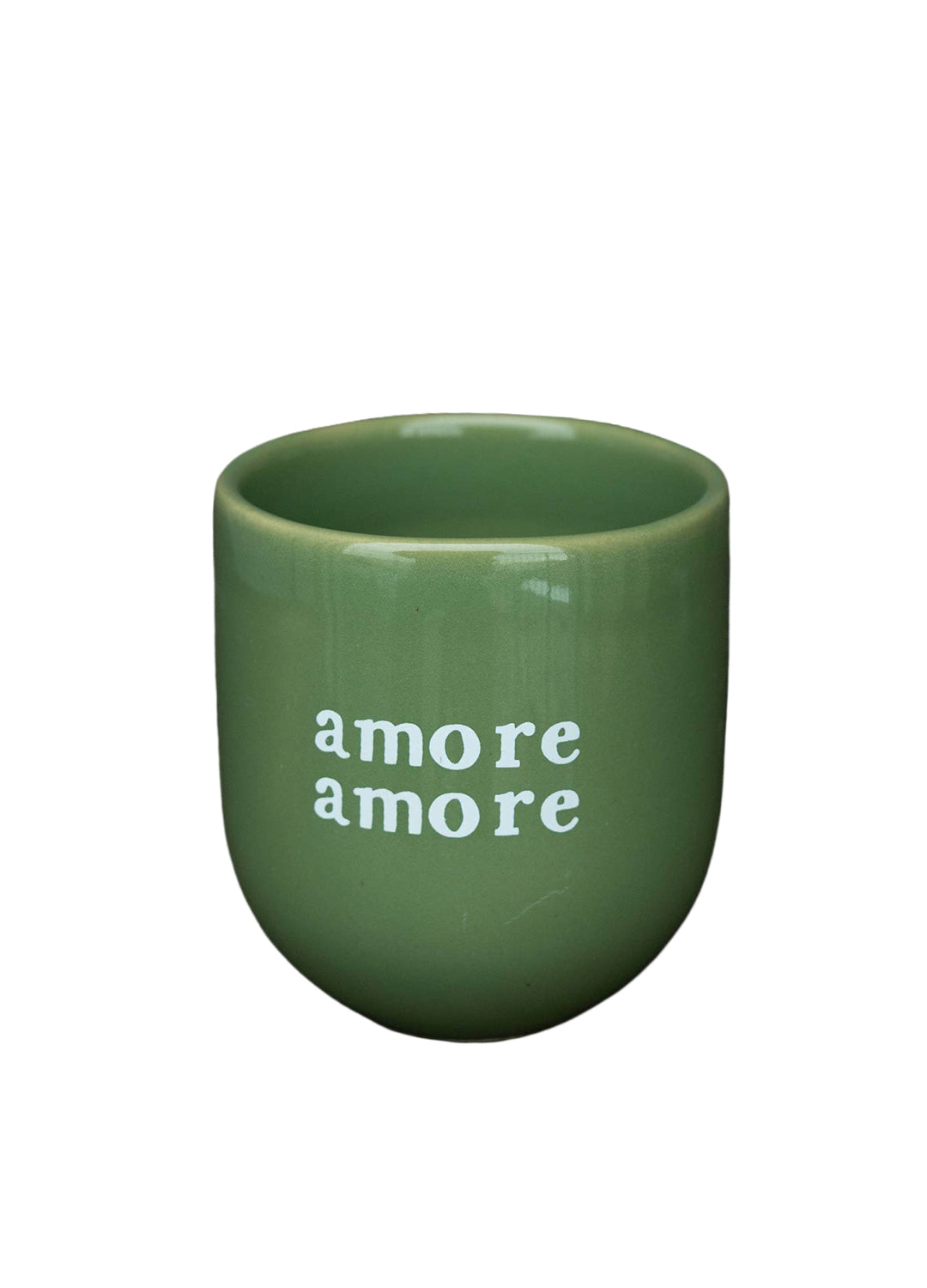 Green mug with 'amore amore' text on a white background