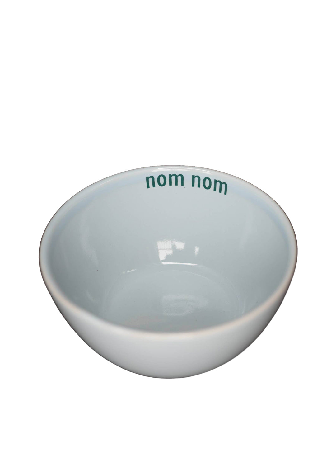 White ceramic bowl with 'nom nom' text on a white background
