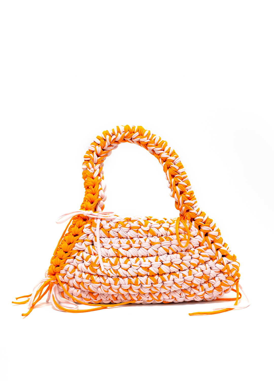 an orange pink weaved crochet shoulder bag on a white background