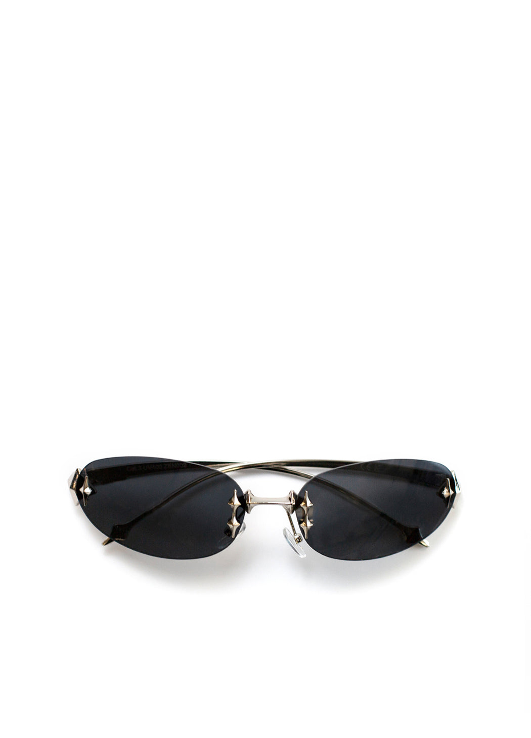 Sunglasses with black lenses and gold frame on a white background