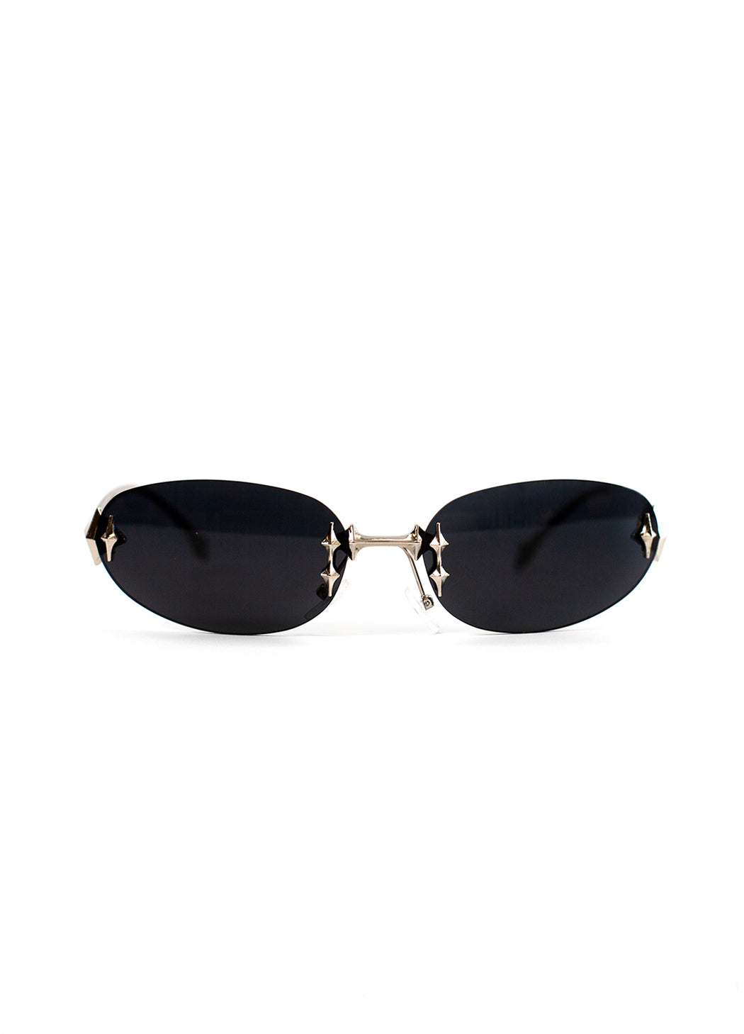 Sunglasses with black oval y2k lenses and silver frames on a white background. 