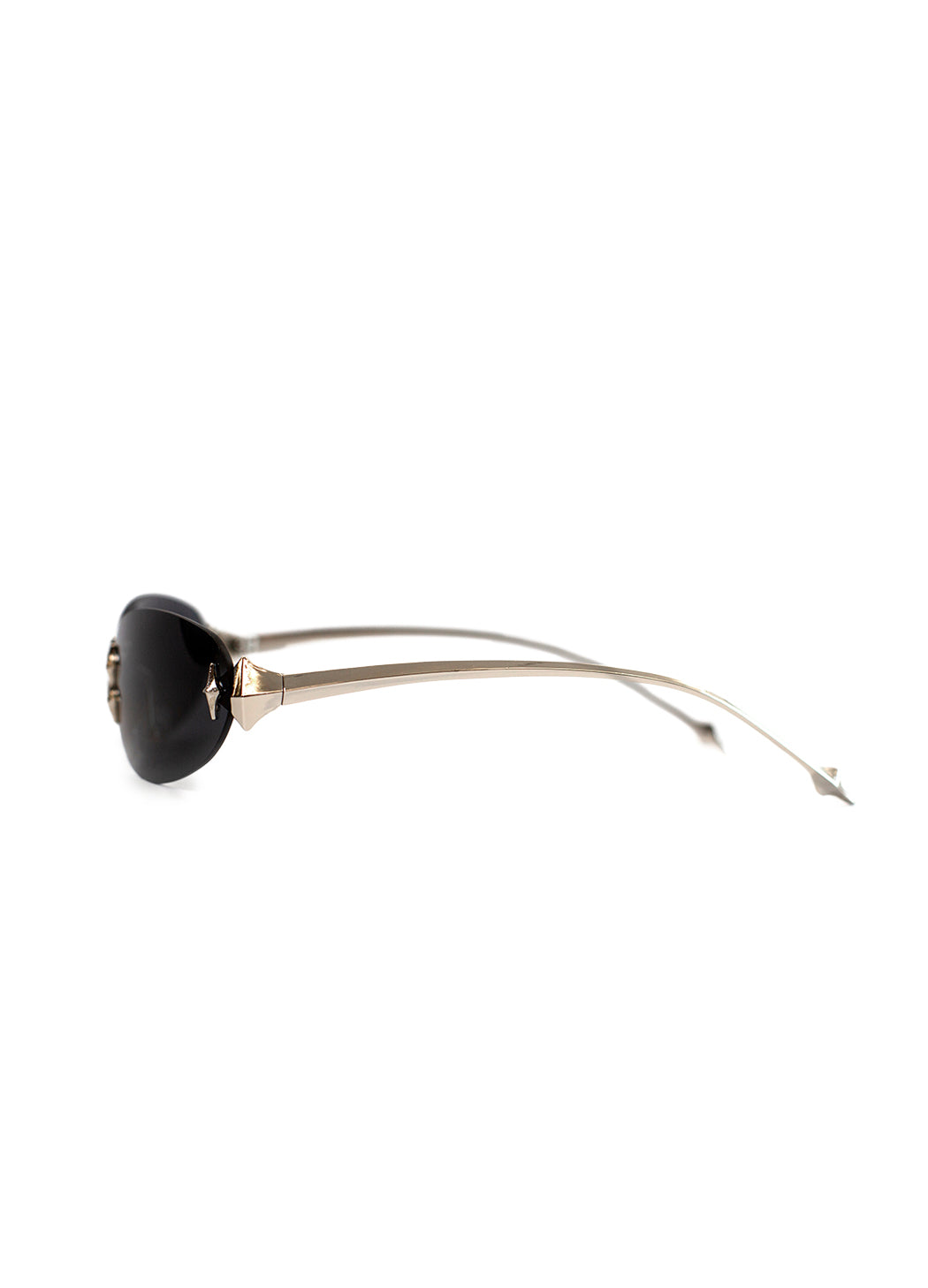 Sunglasses with black oval y2k lenses and silver frames on a white background. 